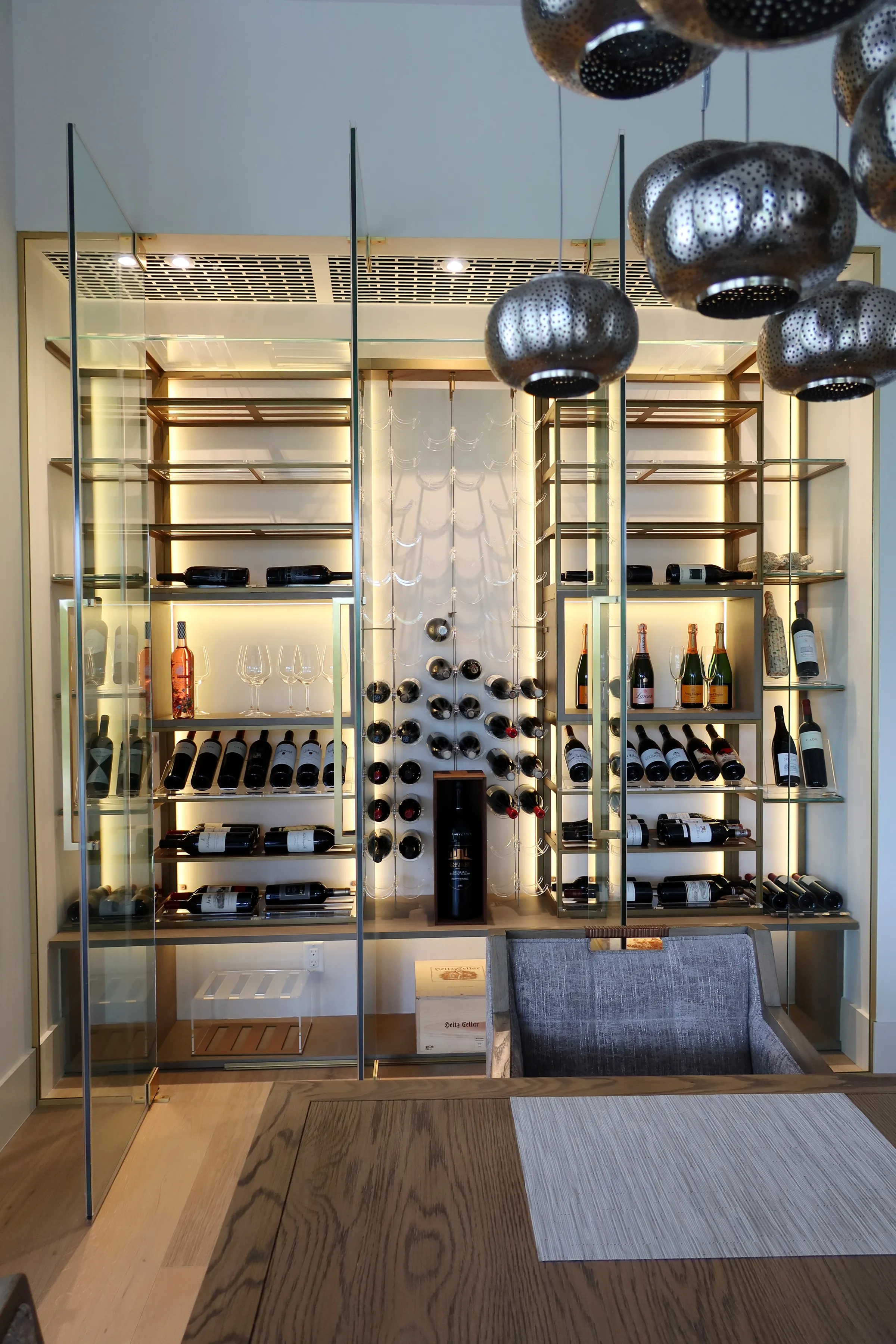 Custom wine wall Miami featuring glass enclosure, illuminated bottle displays, and contemporary luxury wine storage — photograph 2 of 3