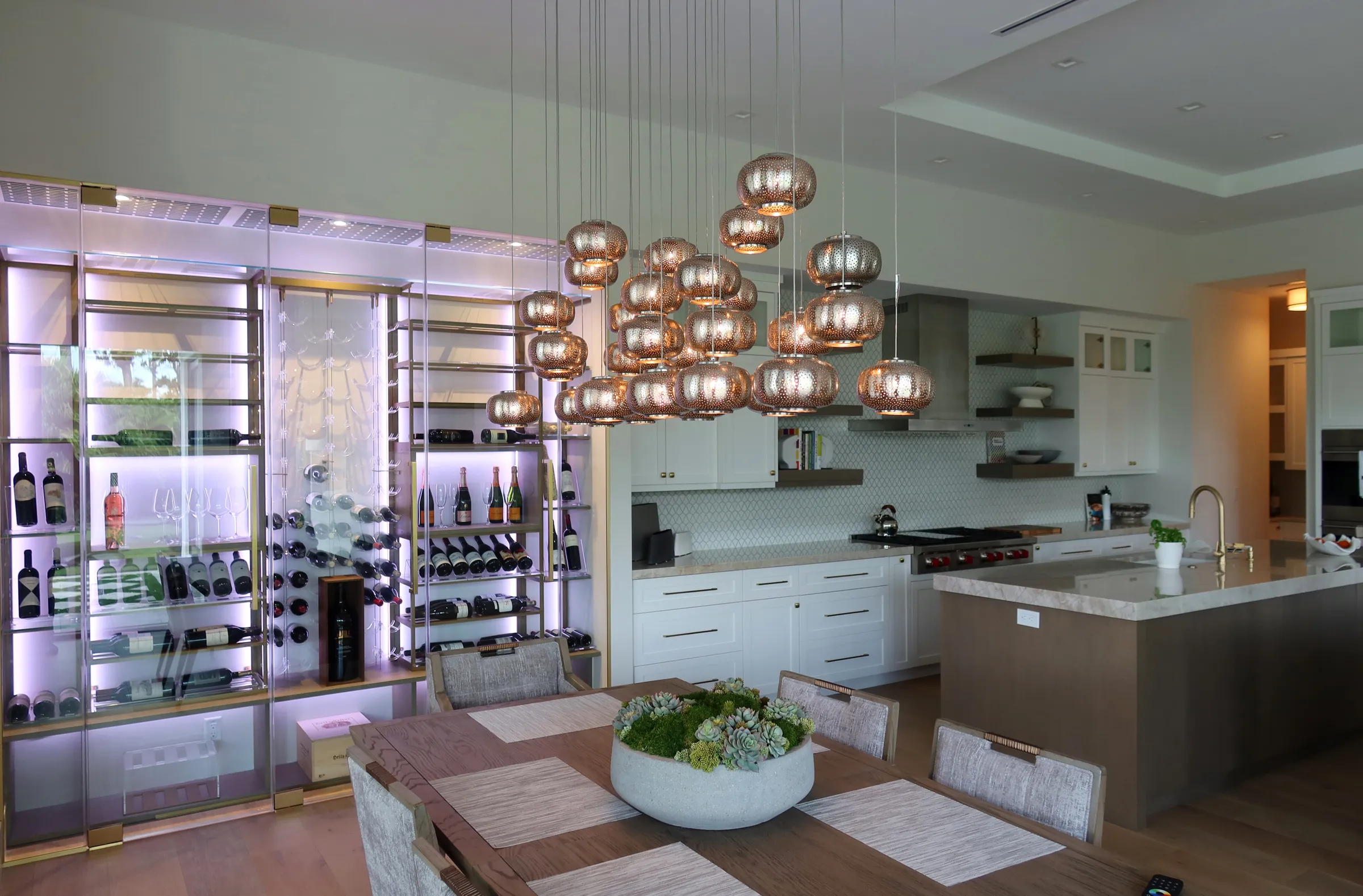 Custom wine wall Miami featuring glass enclosure, illuminated bottle displays, and contemporary luxury wine storage — photograph 3 of 3
