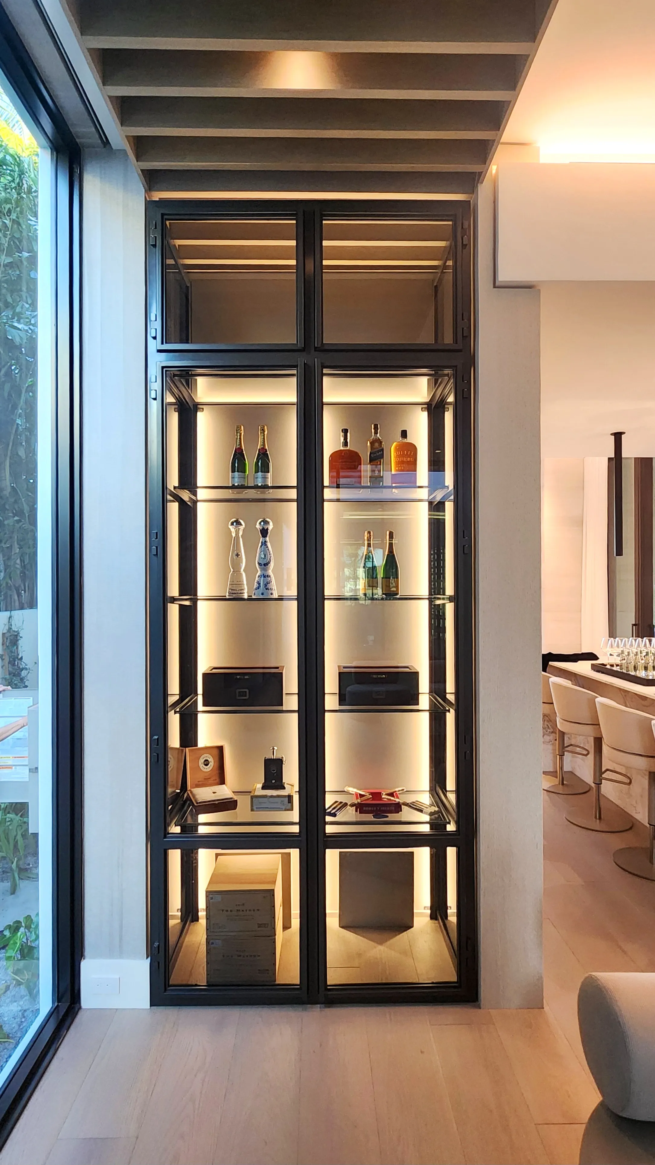 Custom dual wine wall Palm Beach featuring glass enclosure, illuminated bottle displays, and modern luxury wine storage — photograph 3 of 4
