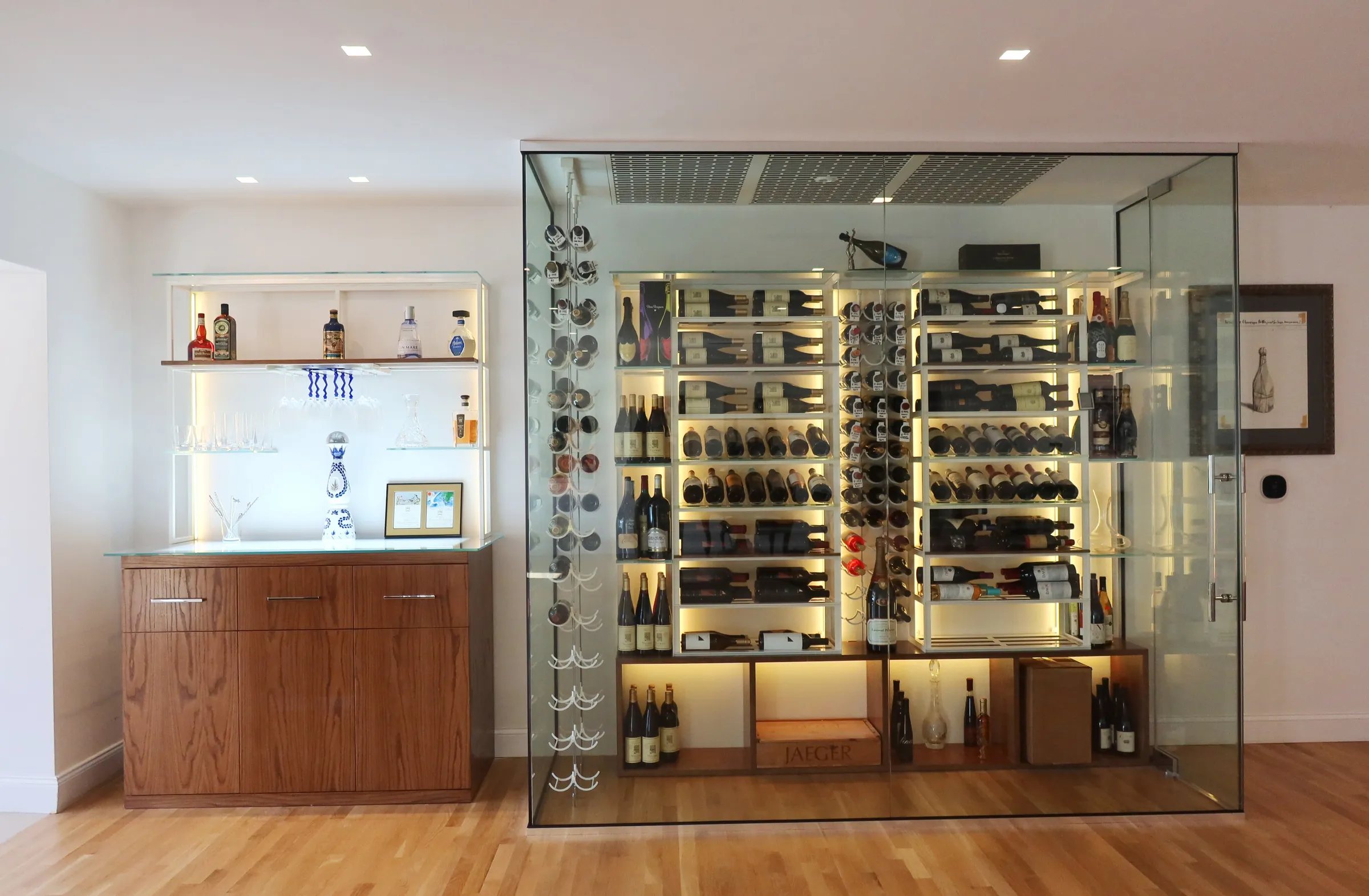 Luxury glass wine room Miami featuring custom floor-to-ceiling metal and wooden wine racks, LED lighting, and bar — photograph 3 of 6