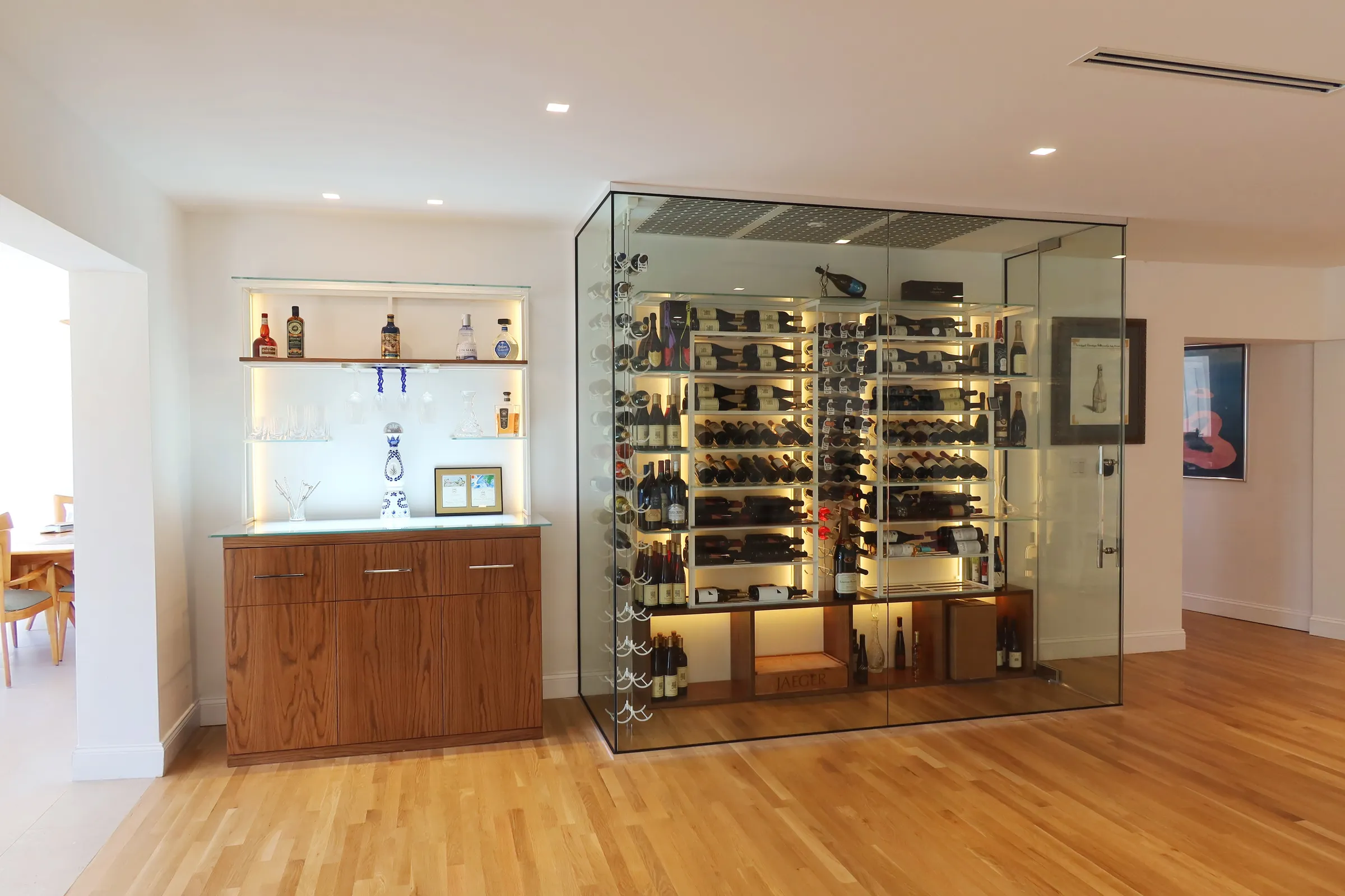 Luxury glass wine room Miami featuring custom floor-to-ceiling metal and wooden wine racks, LED lighting, and bar — photograph 5 of 6
