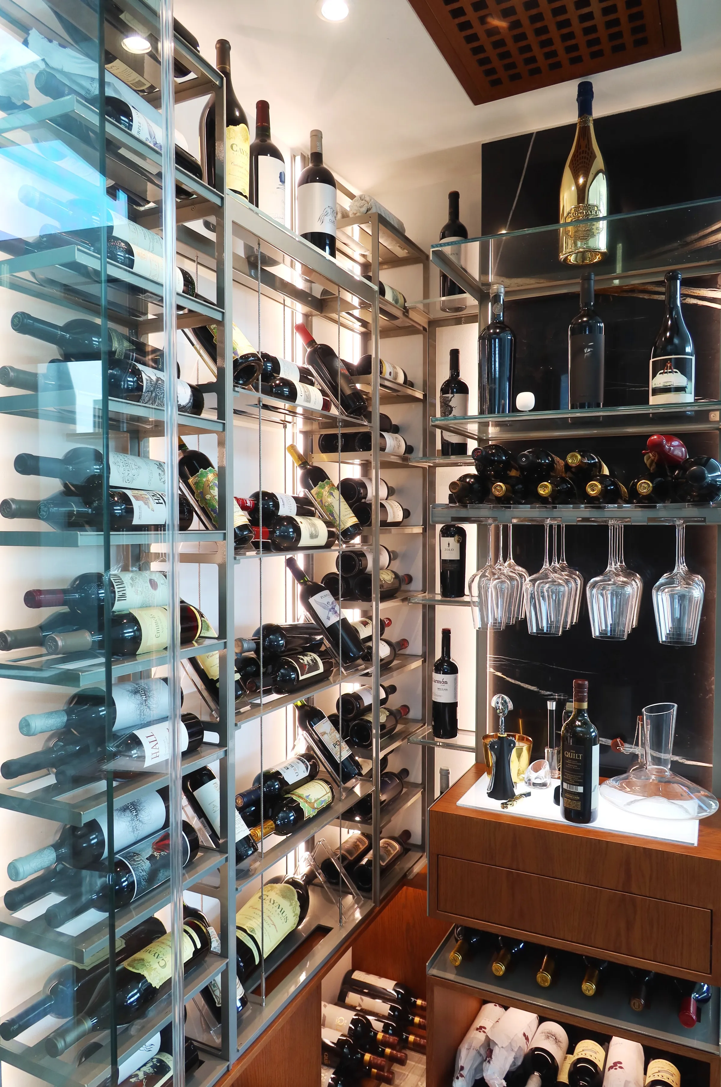 Luxury wine room Miami featuring custom floor-to-ceiling metal and wooden wine racks, and LED lighting, modern style — photograph 3 of 5