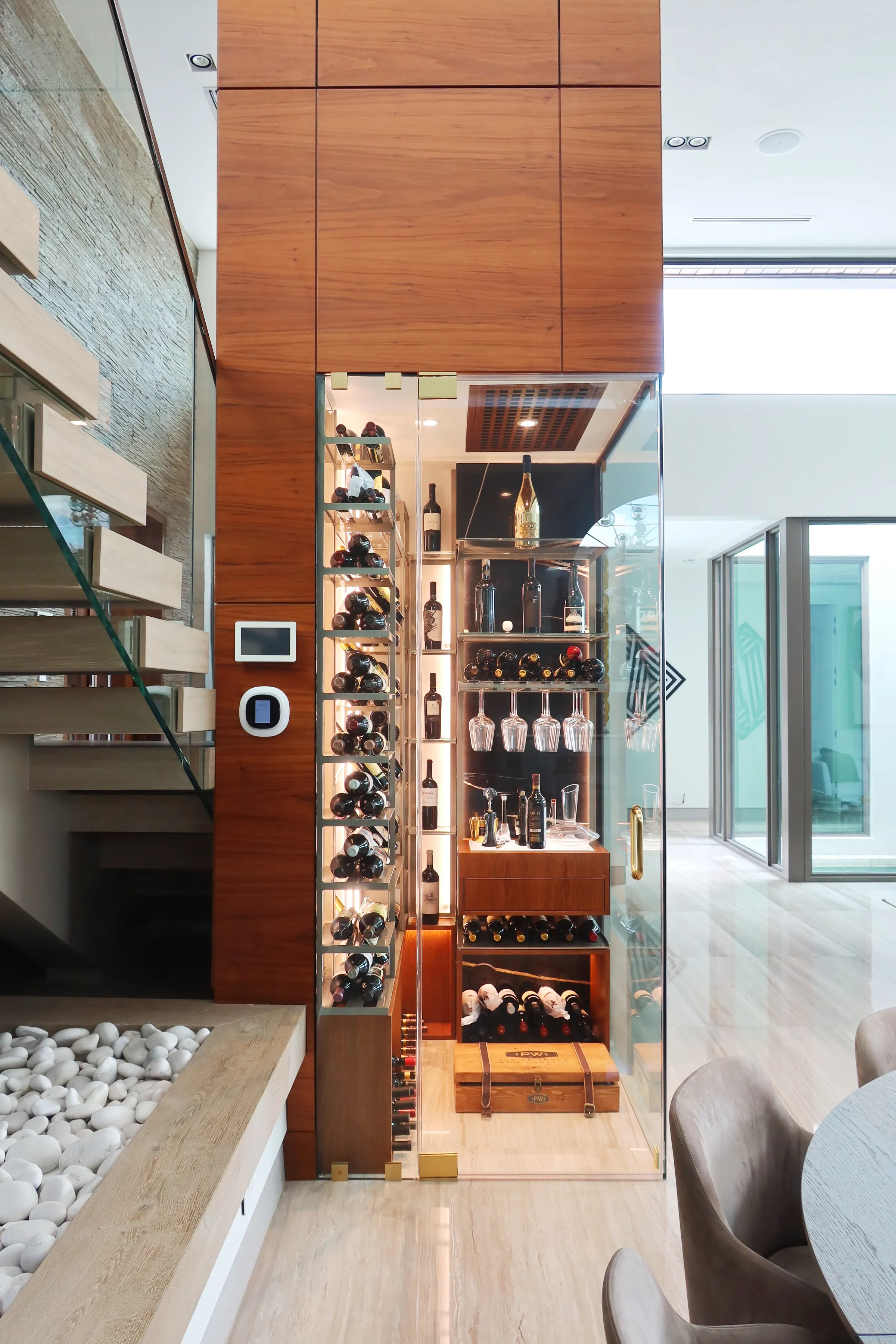 Luxury wine room Miami featuring custom floor-to-ceiling metal and wooden wine racks, and LED lighting, modern style — photograph 4 of 5