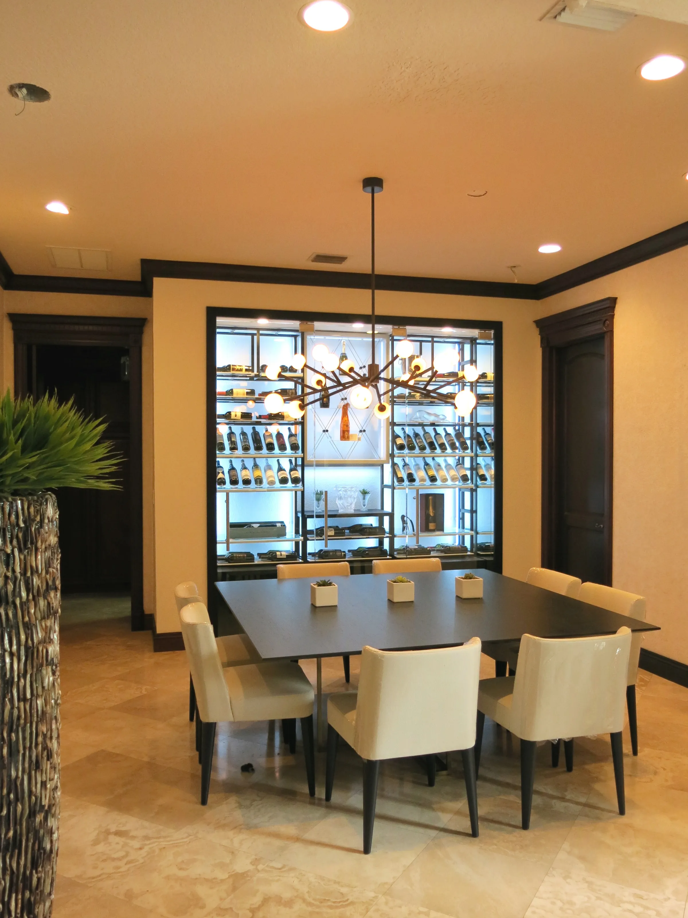 Custom wine wall Miami featuring glass enclosure, illuminated bottle displays, and modern luxury wine storage — photograph 2 of 3