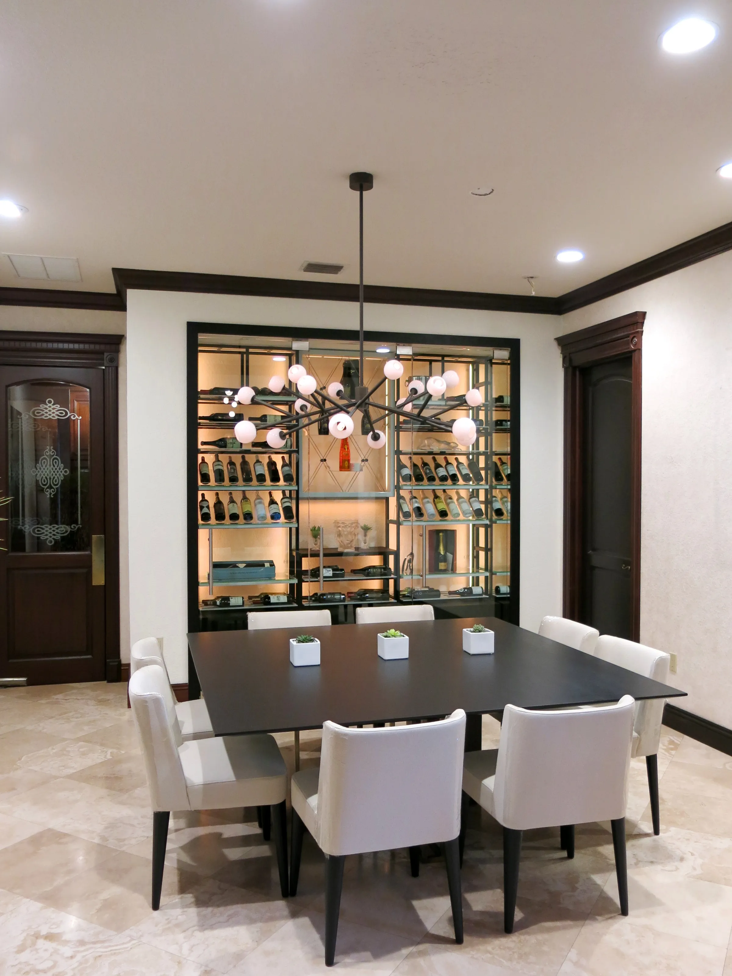 Custom wine wall Miami featuring glass enclosure, illuminated bottle displays, and modern luxury wine storage — photograph 3 of 3