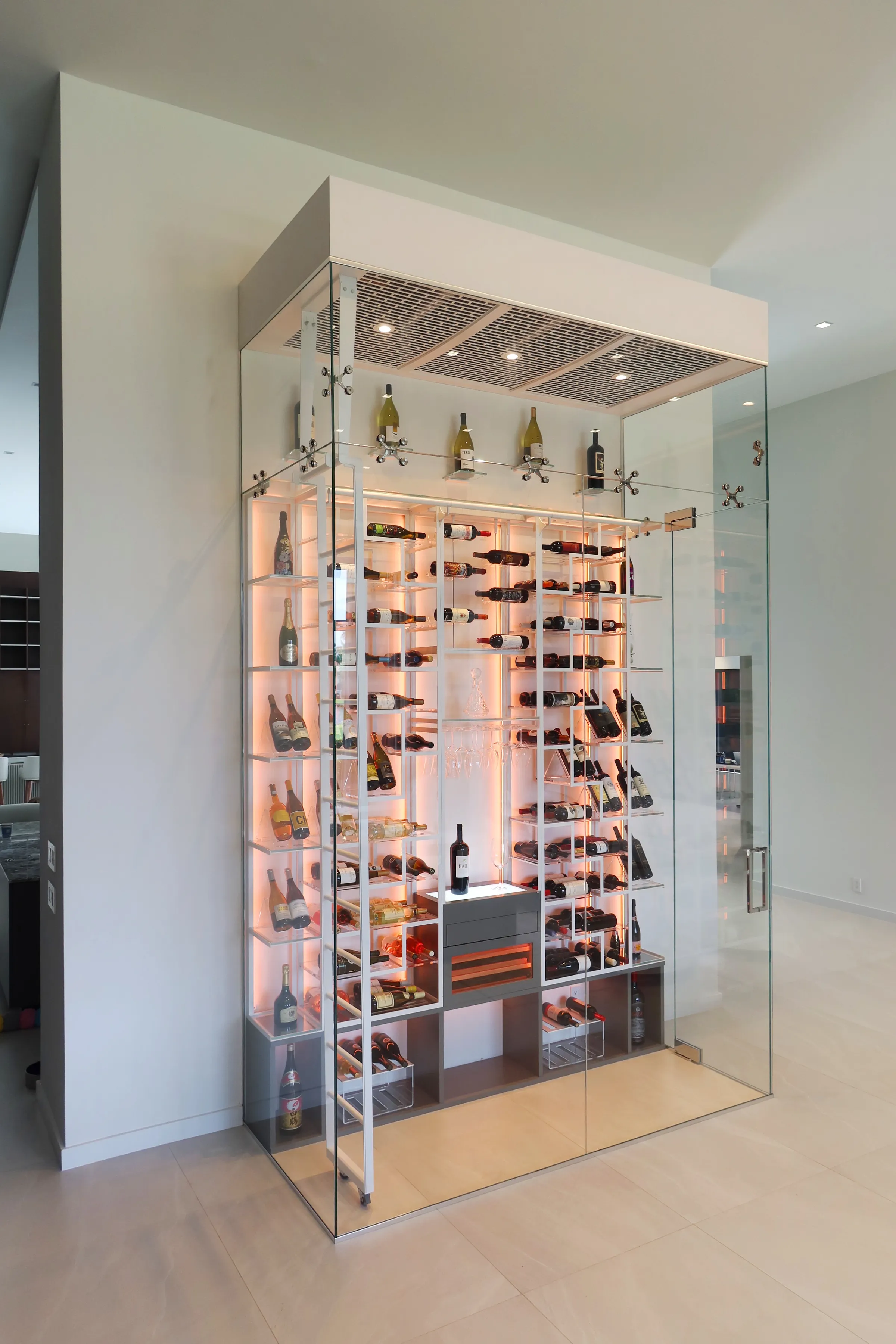 Luxury glass wine cellar Miami featuring custom floor-to-ceiling metal wine racks, LED lighting, and humidor — photograph 1 of 6