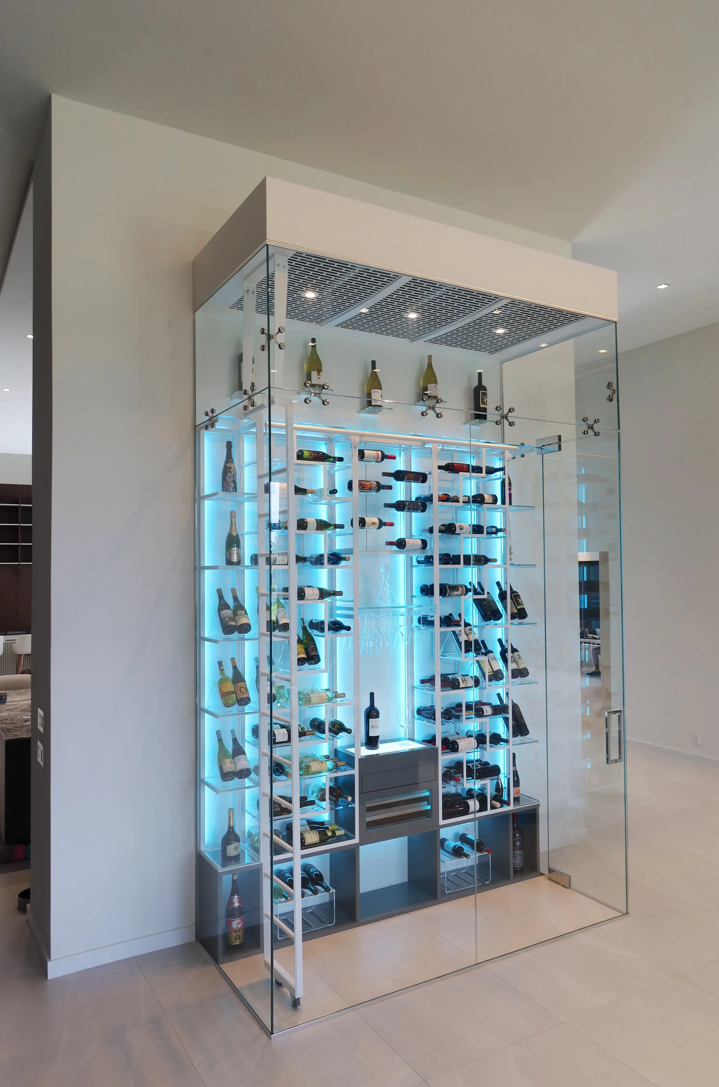Luxury glass wine cellar Miami featuring custom floor-to-ceiling metal wine racks, LED lighting, and humidor — photograph 3 of 6