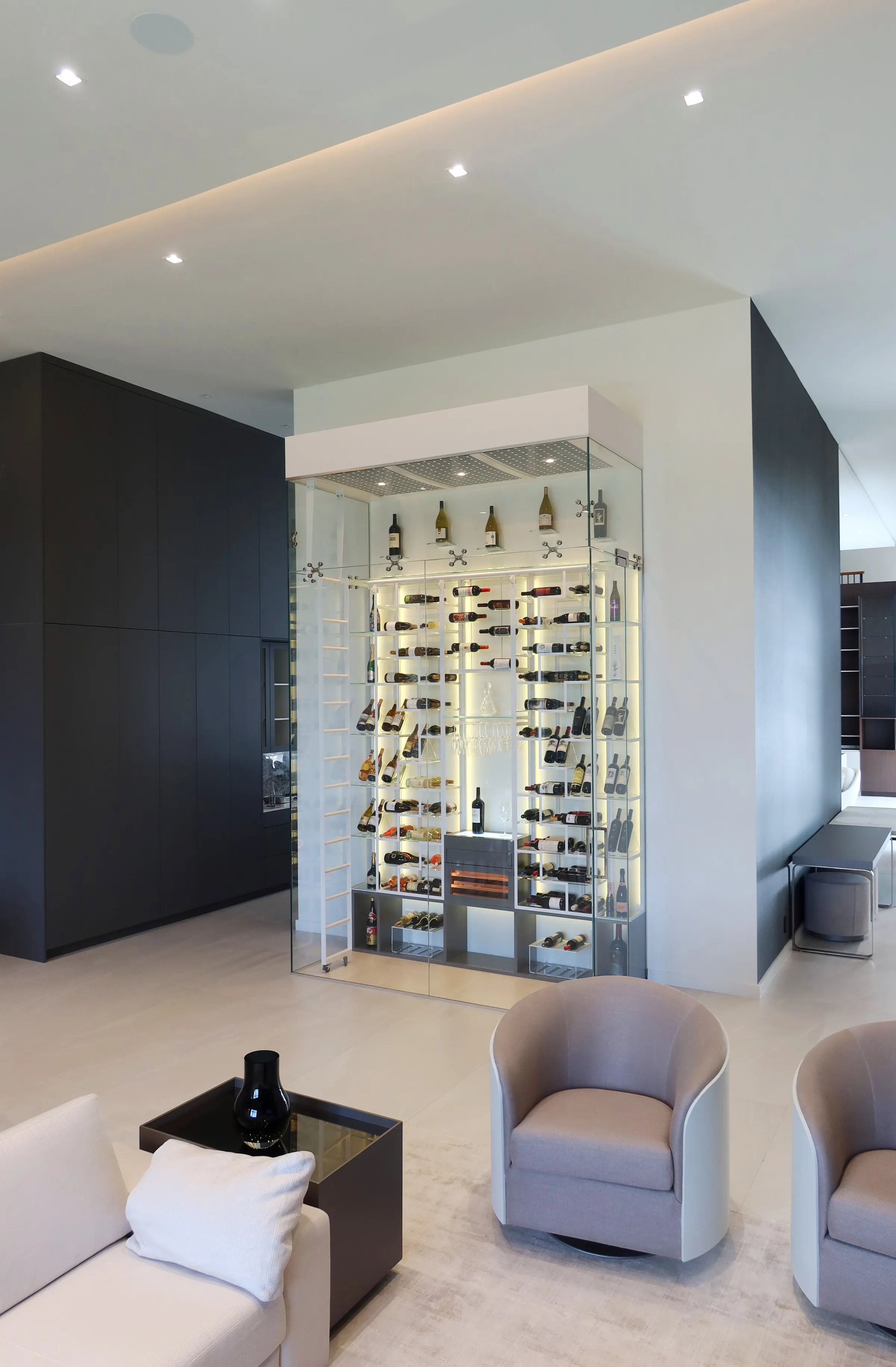 Luxury glass wine cellar Miami featuring custom floor-to-ceiling metal wine racks, LED lighting, and humidor — photograph 6 of 6
