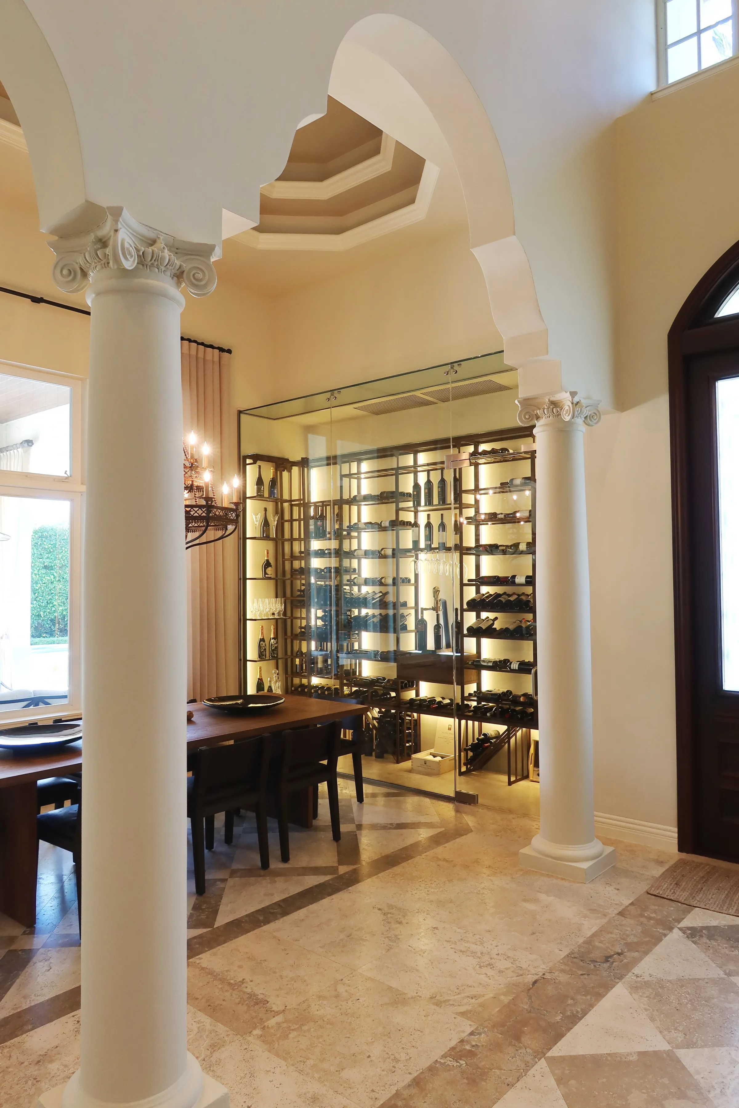 Luxury glass wine cellar Miami featuring custom floor-to-ceiling metal and wooden wine racks, and LED lighting — photograph 1 of 4
