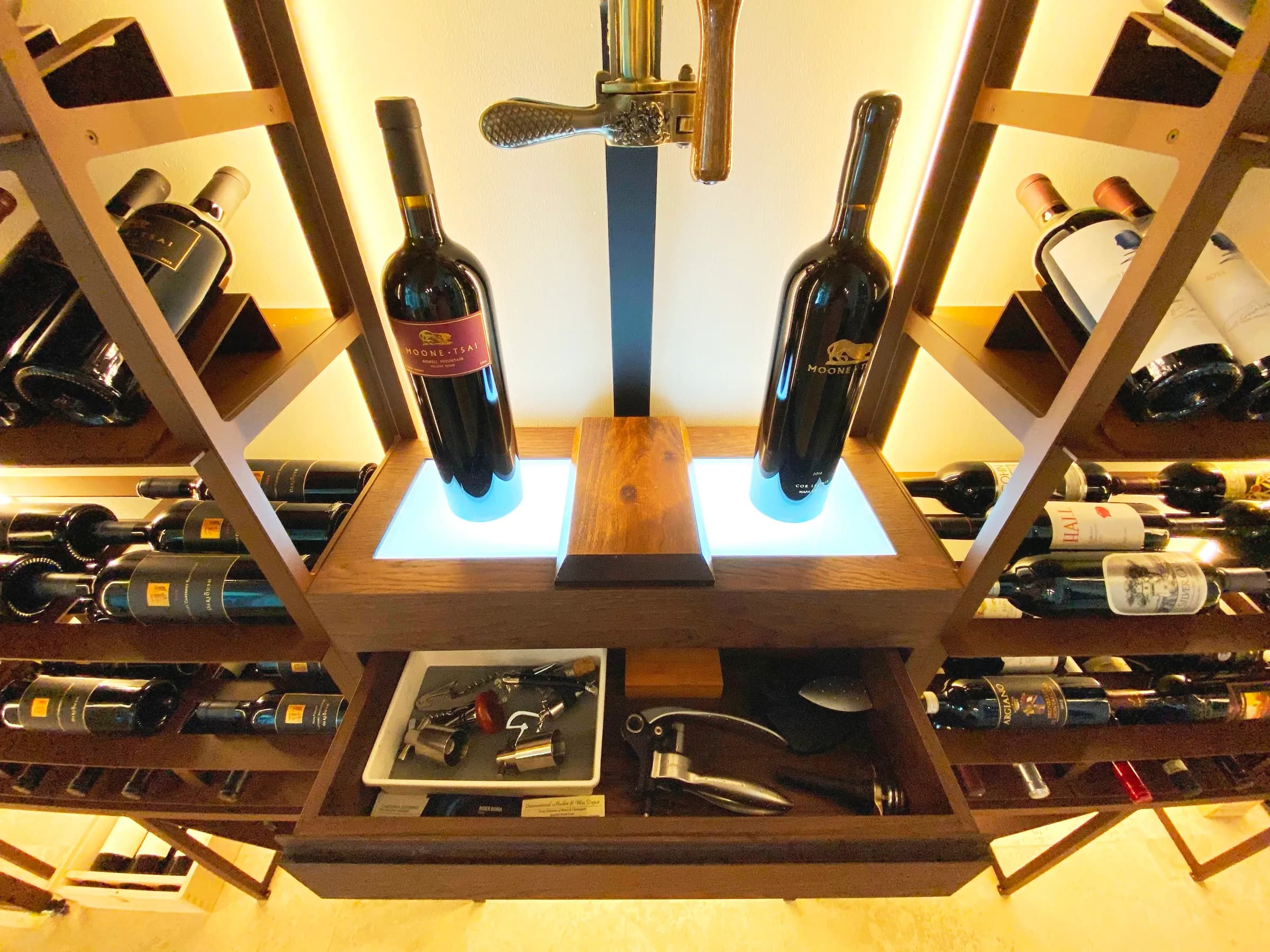 Luxury glass wine cellar Miami featuring custom floor-to-ceiling metal and wooden wine racks, and LED lighting — photograph 2 of 4