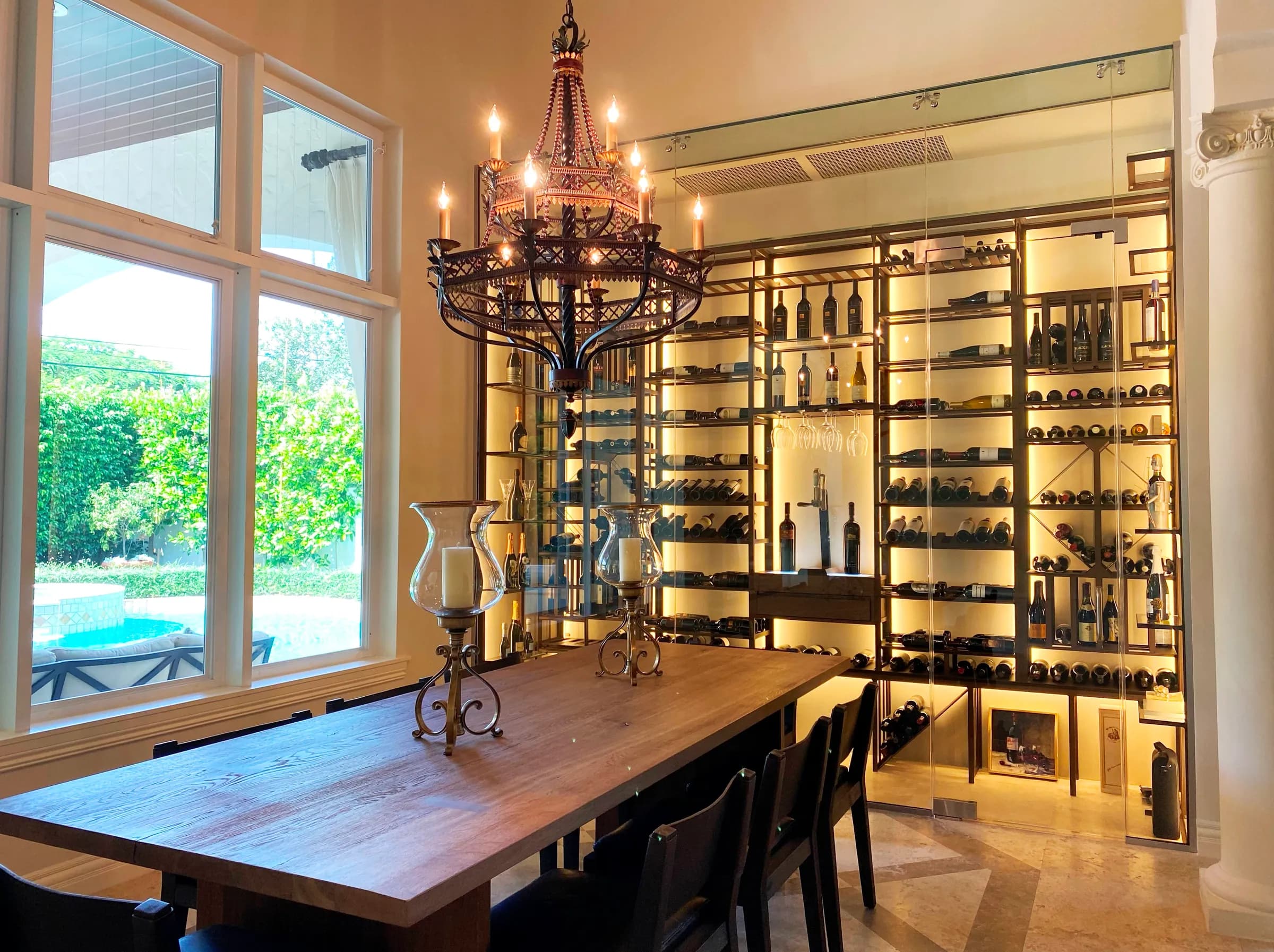 Luxury glass wine cellar Miami featuring custom floor-to-ceiling metal and wooden wine racks, and LED lighting — photograph 3 of 4