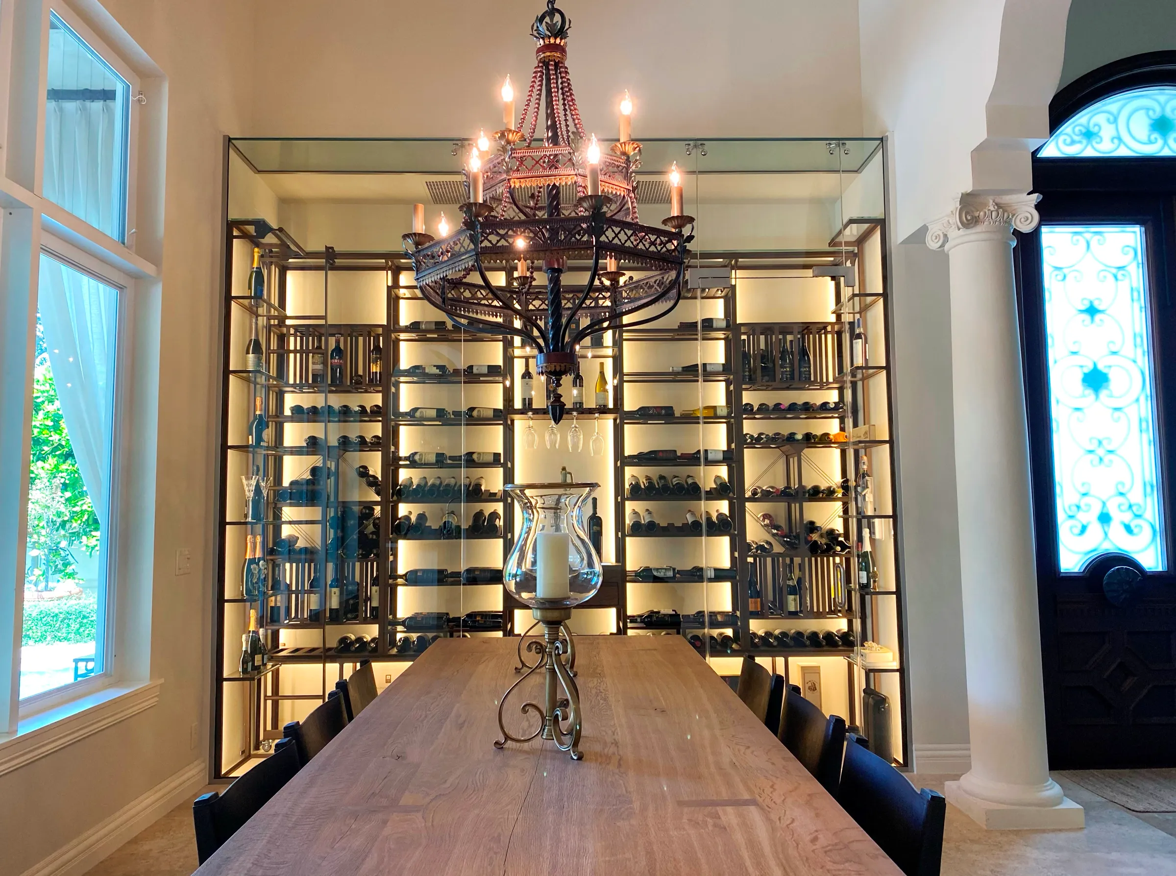 Luxury glass wine cellar Miami featuring custom floor-to-ceiling metal and wooden wine racks, and LED lighting — photograph 4 of 4