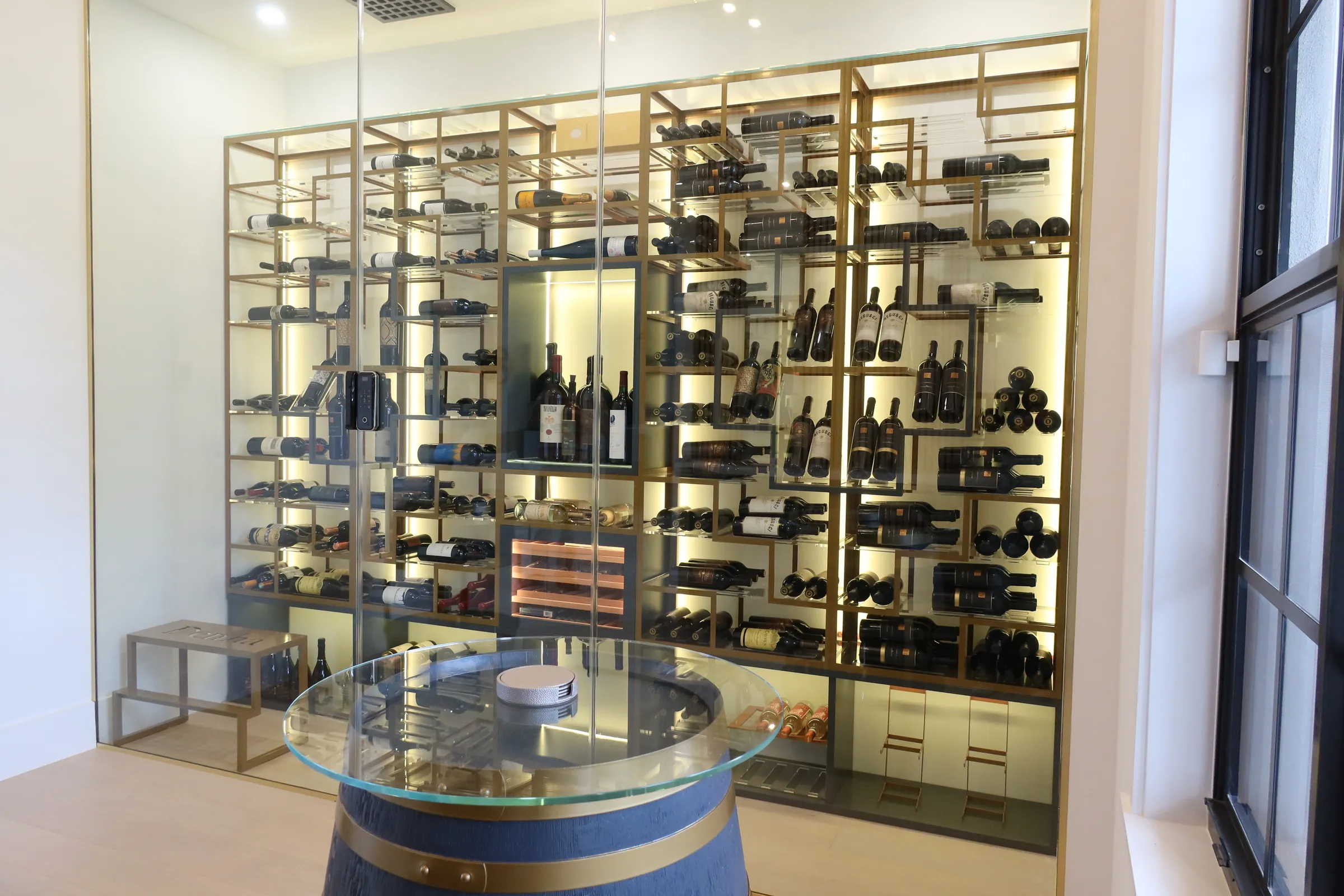 Luxury glass wine cellar Miami featuring custom floor-to-ceiling metal and wooden wine racks, and LED lighting — photograph 1 of 4