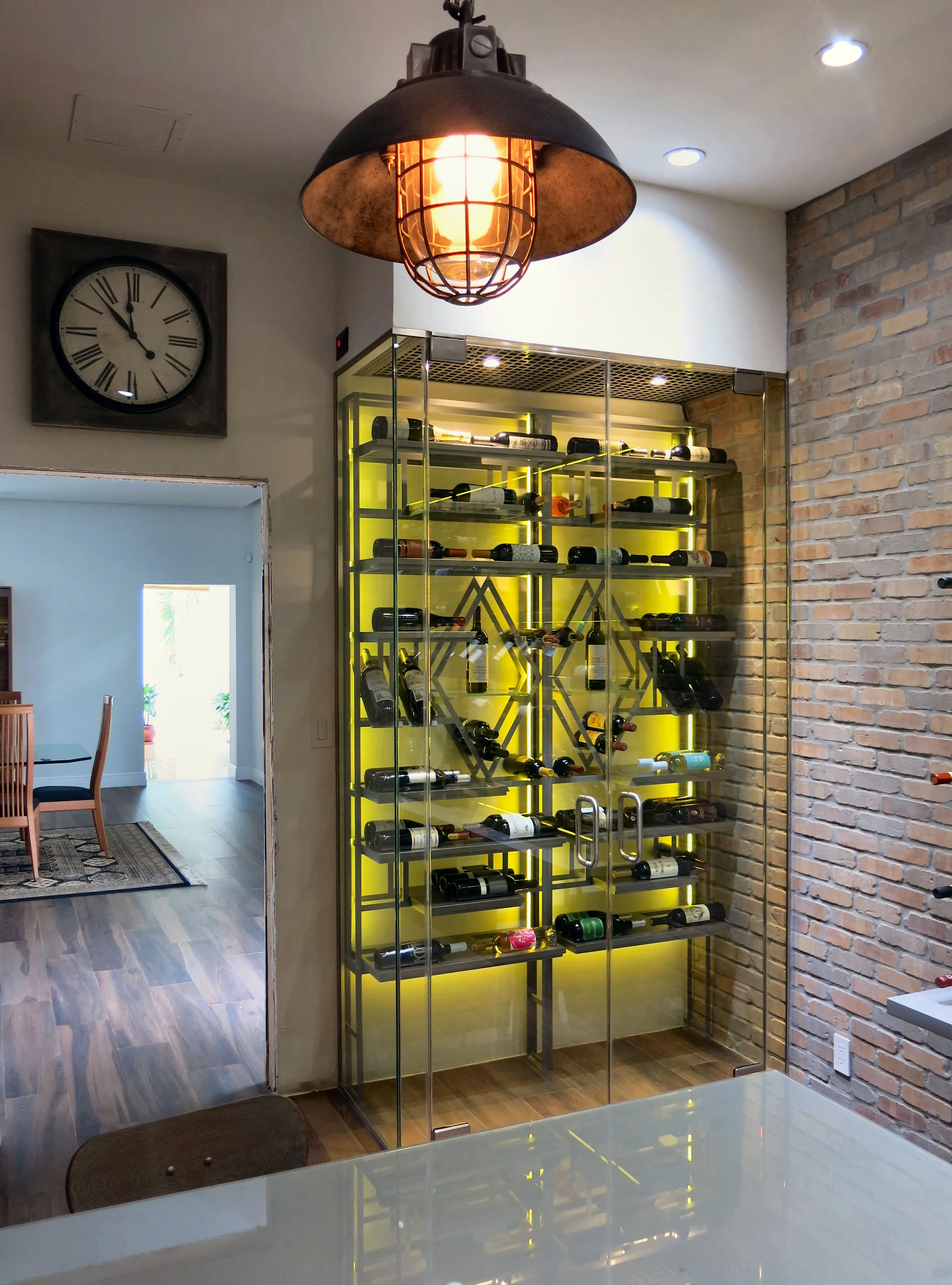 Luxury wine room Miami featuring custom floor-to-ceiling metal wine racks, and LED lighting, modern style — photograph 1 of 5