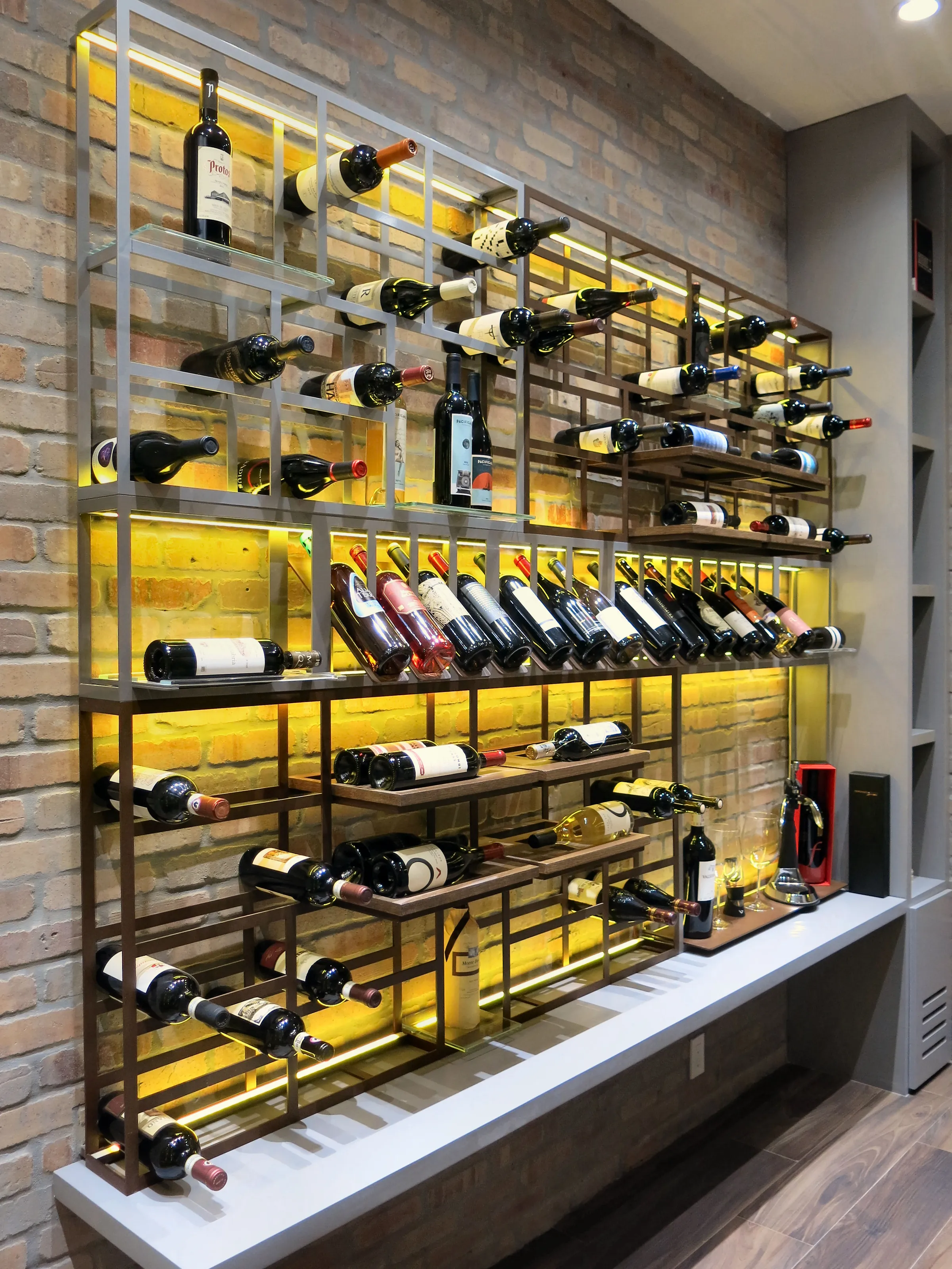 Luxury wine room Miami featuring custom floor-to-ceiling metal wine racks, and LED lighting, modern style — photograph 2 of 5