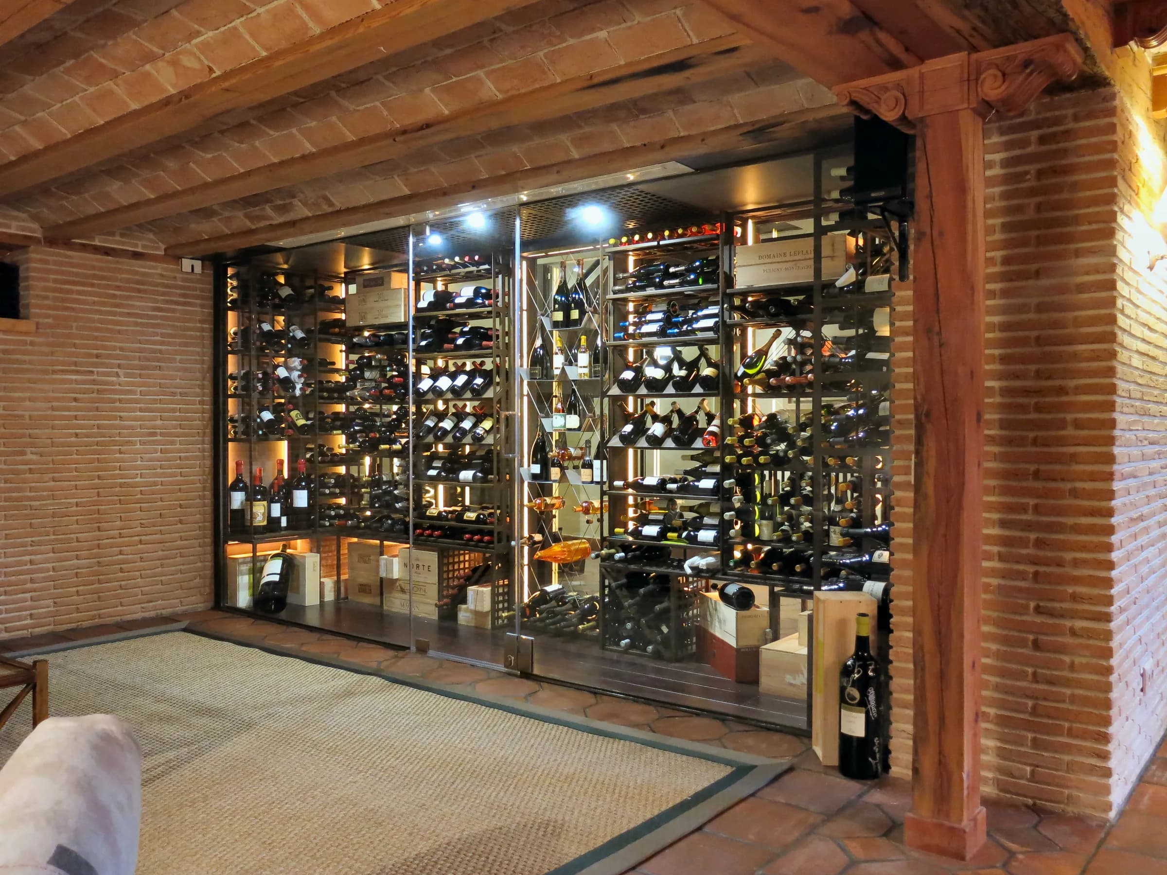 Understairs wine cellar, premium metal wine racks, luxury residential wine room — photograph 3 of 3