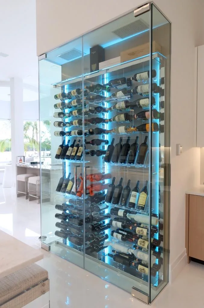 Modern Wine Wall Jupiter Florida - kitchen-integrated cable system racks, acrylic hooks, floating effect, LED strips, wooden back panel — photograph 2 of 3
