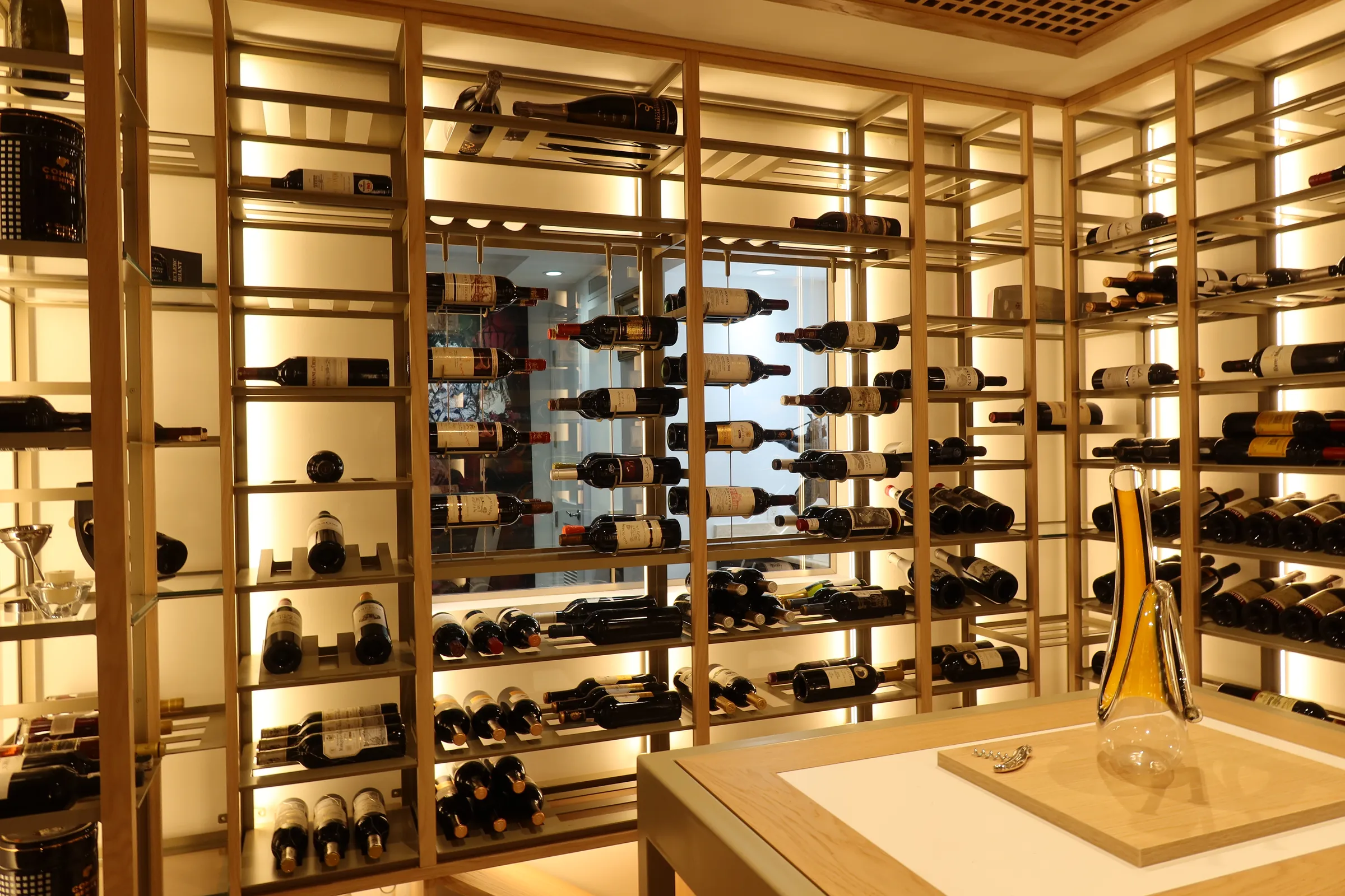 Luxury home wine cellar Florida custom wine racks glass panels Bella Vista