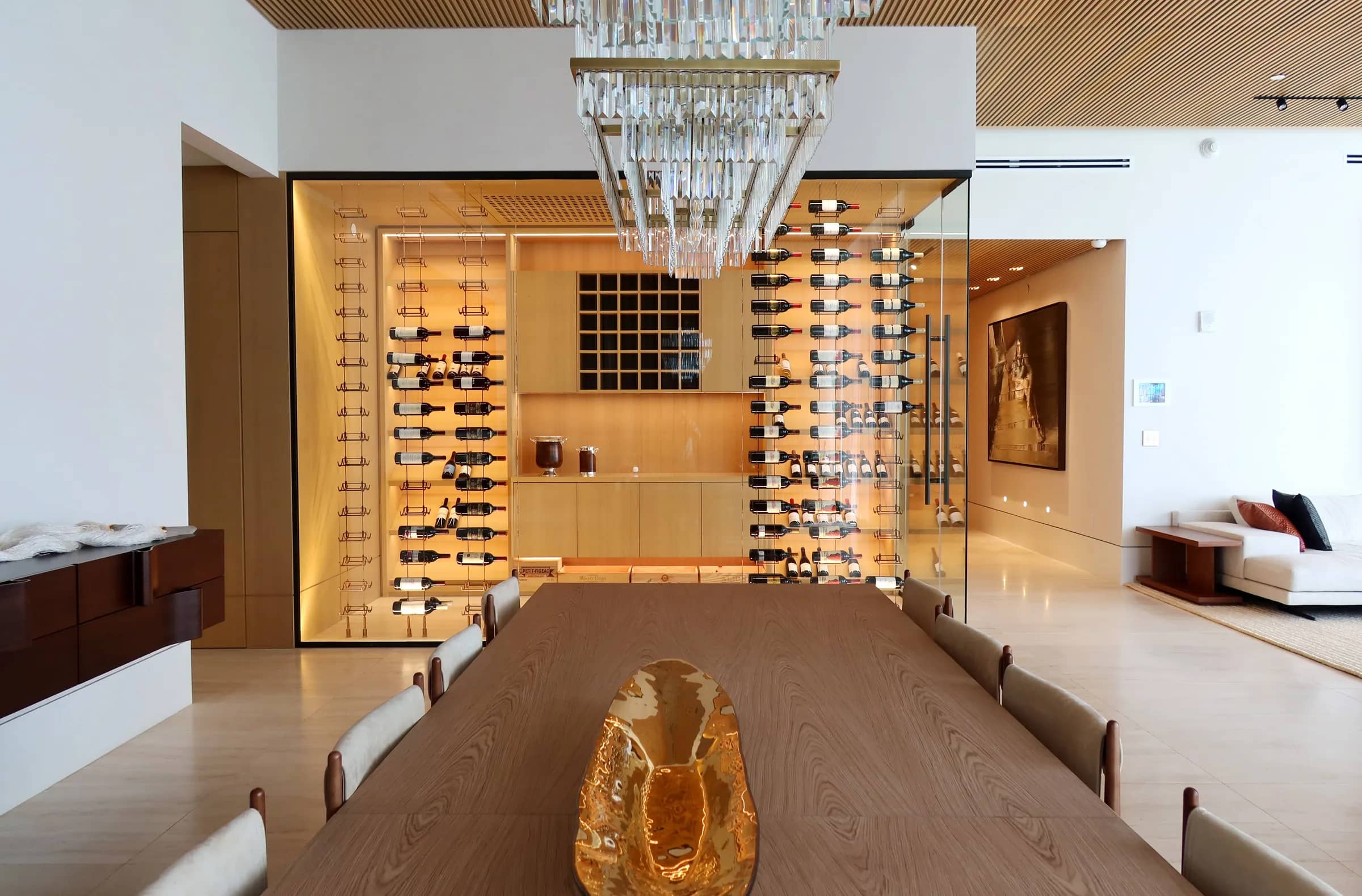 Luxury transitional wine cellar Florida Ritz Carlton - wooden wine racks, cable system rust finish, LED lighting