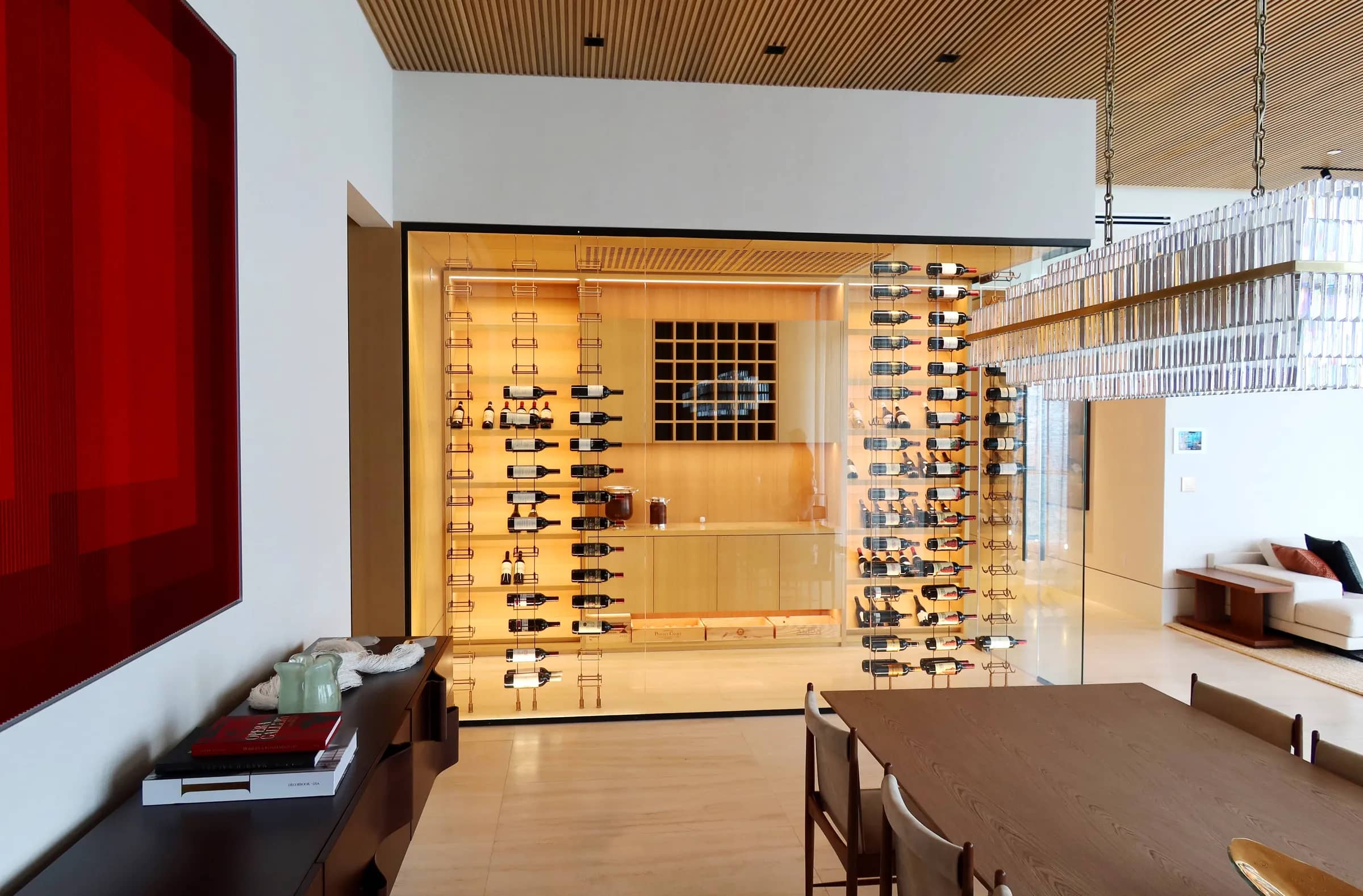 Luxury transitional wine cellar Florida Ritz Carlton - wine crates, wood and cable racks, warm ambiance