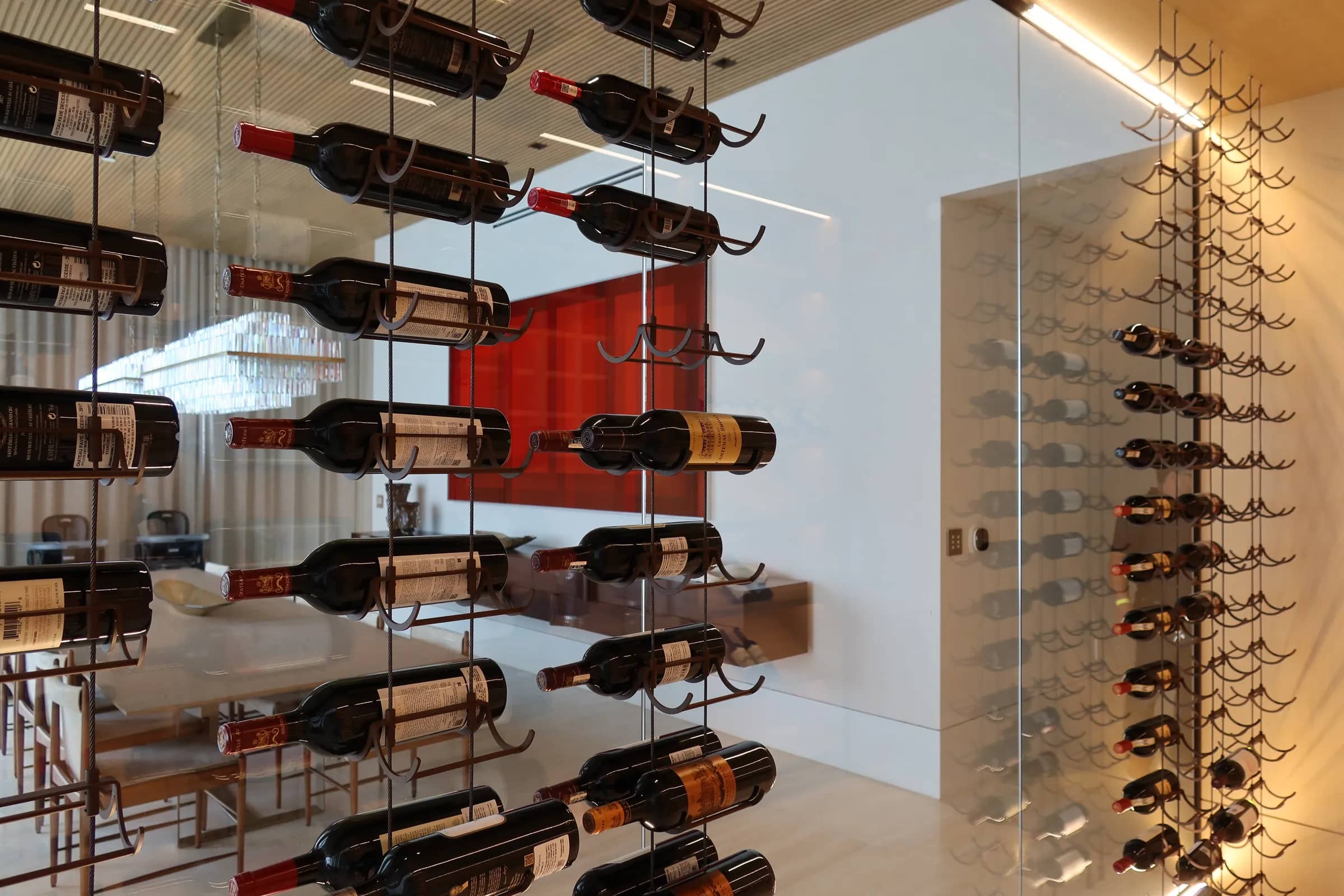Luxury transitional wine cellar Florida Ritz Carlton - elegant wine room, rust finish accents, Sunny Isles