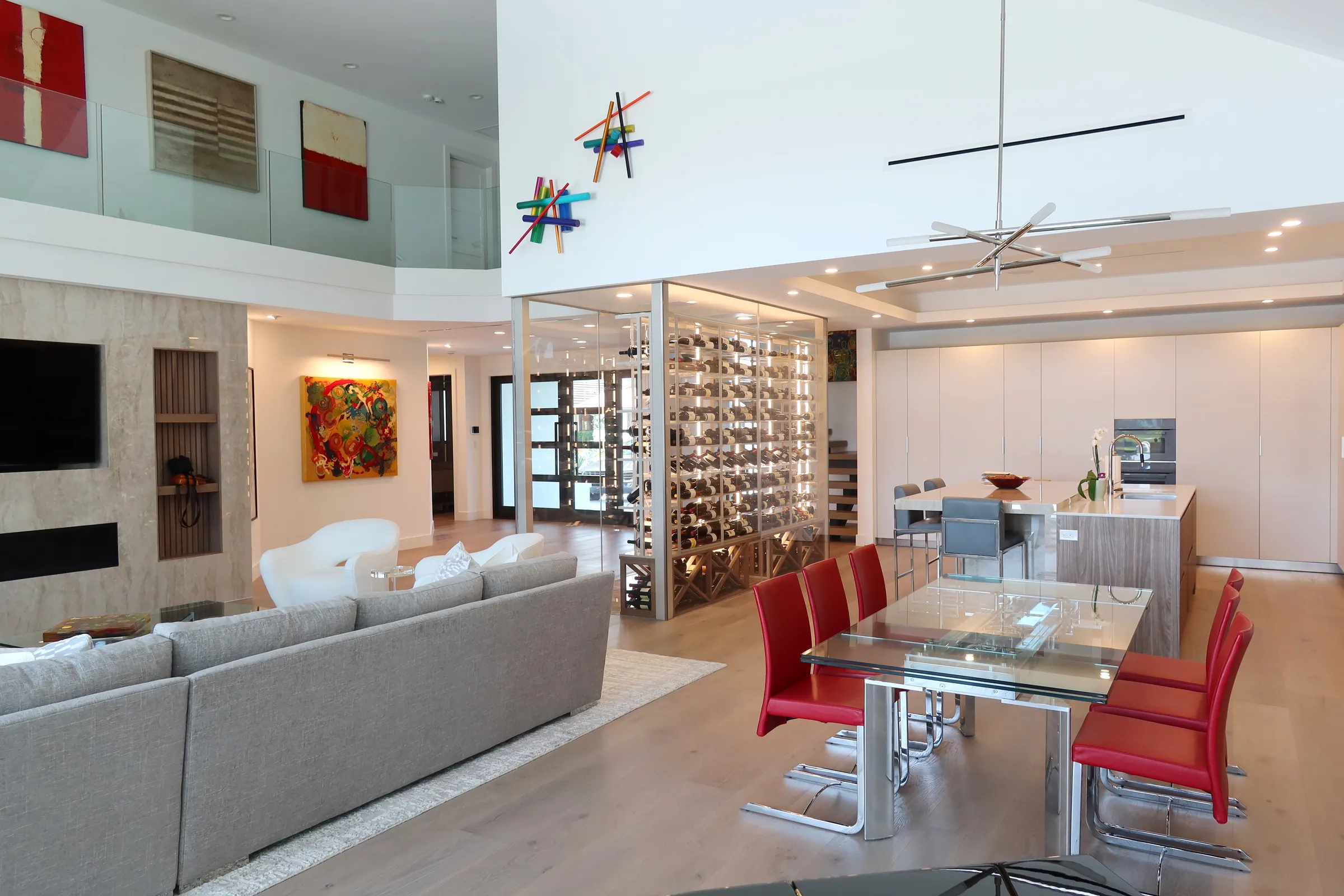 Luxury glass wine cellar Miami featuring custom metal and wooden wine racks, LED lighting, and floor-to-ceiling wine storage — photograph 4 of 9