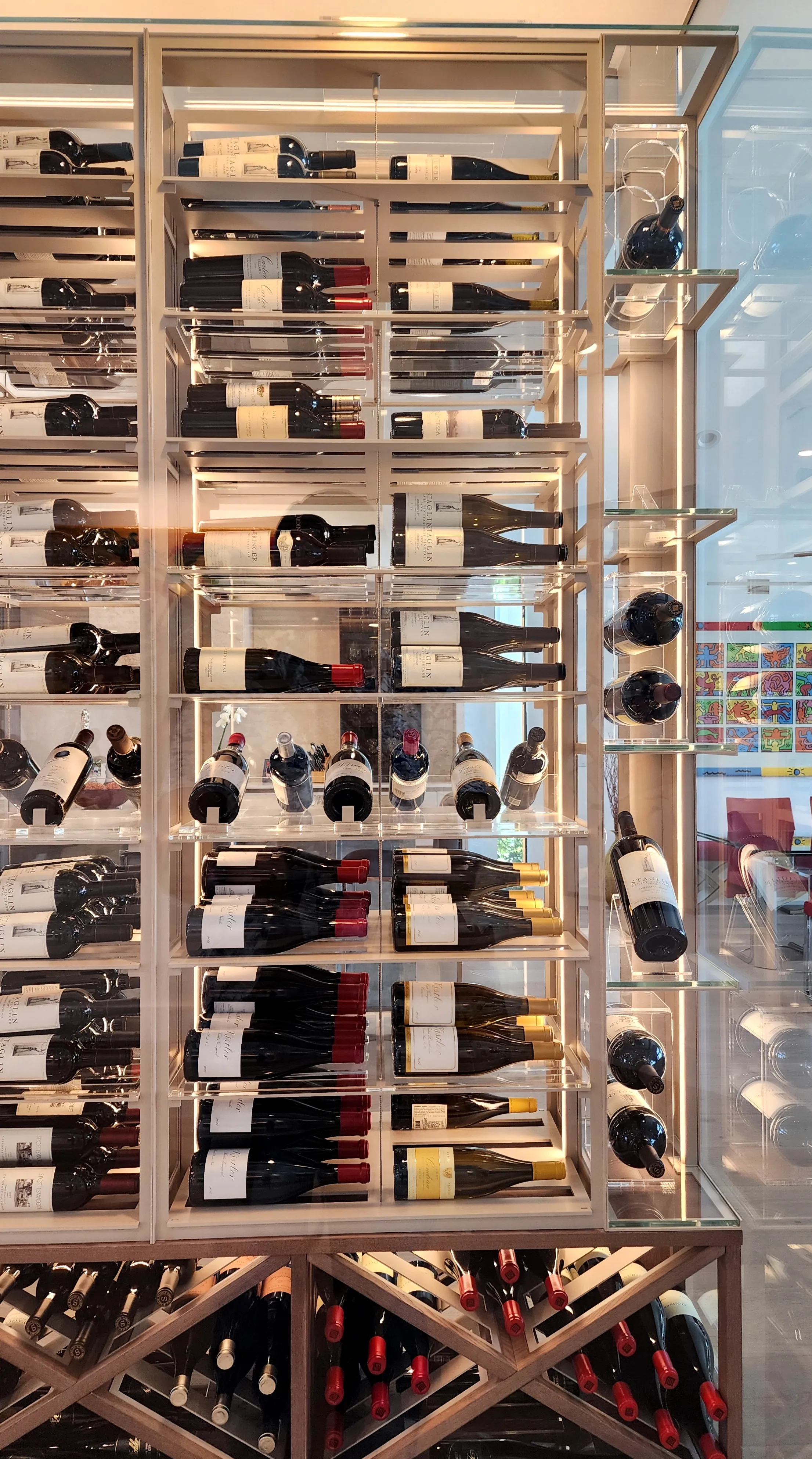 Luxury glass wine cellar Miami featuring custom metal and wooden wine racks, LED lighting, and floor-to-ceiling wine storage — photograph 6 of 9