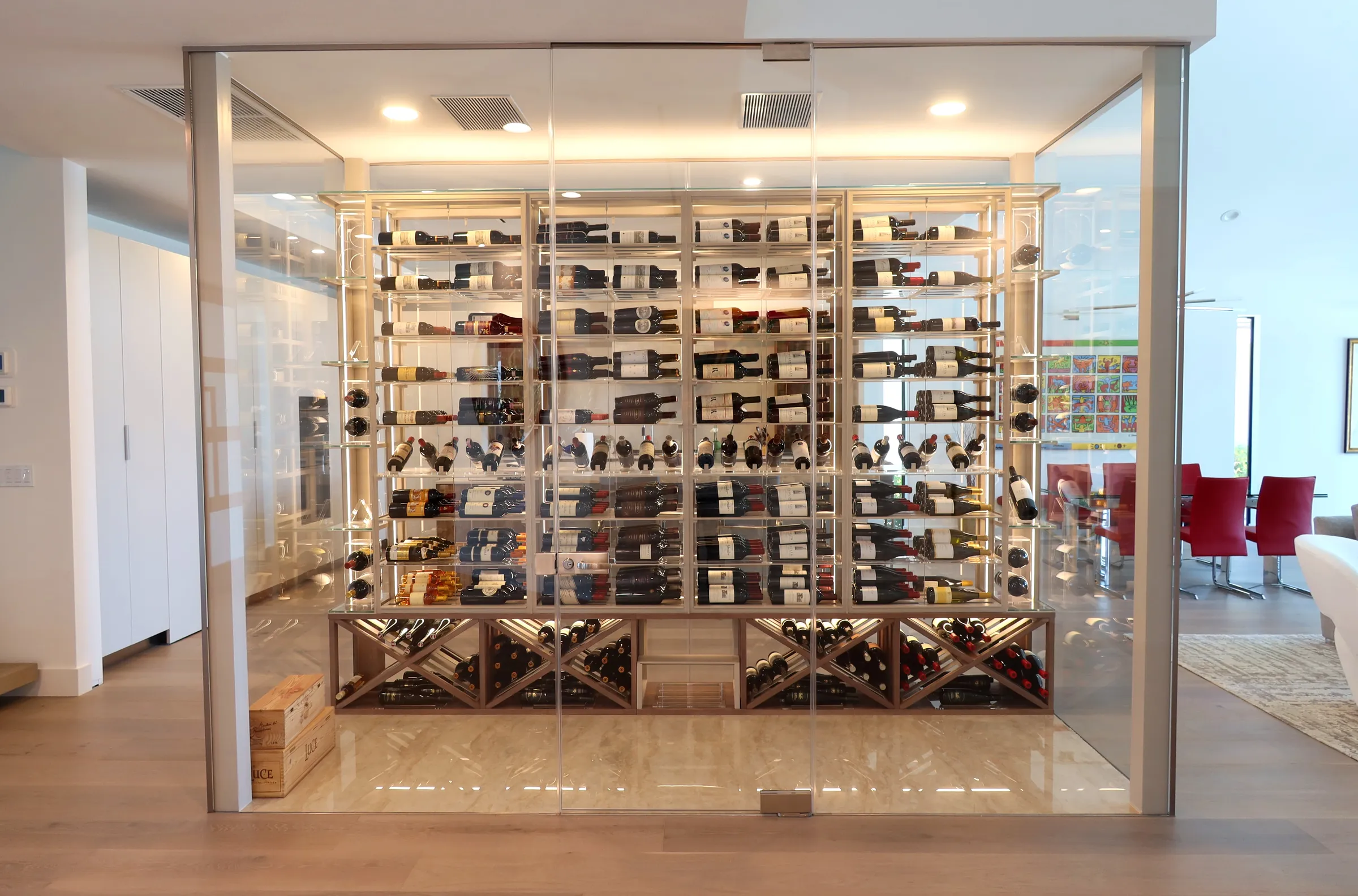Luxury glass wine cellar Miami featuring custom metal and wooden wine racks, LED lighting, and floor-to-ceiling wine storage — photograph 7 of 9