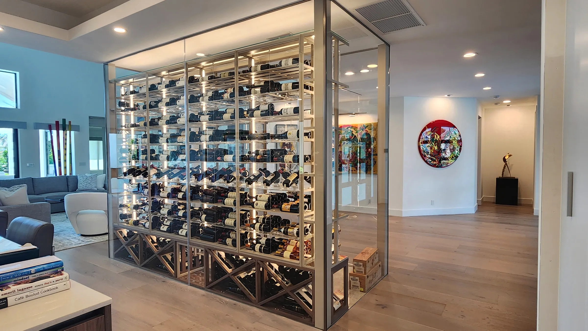 Luxury glass wine cellar Miami featuring custom metal and wooden wine racks, LED lighting, and floor-to-ceiling wine storage — photograph 8 of 9