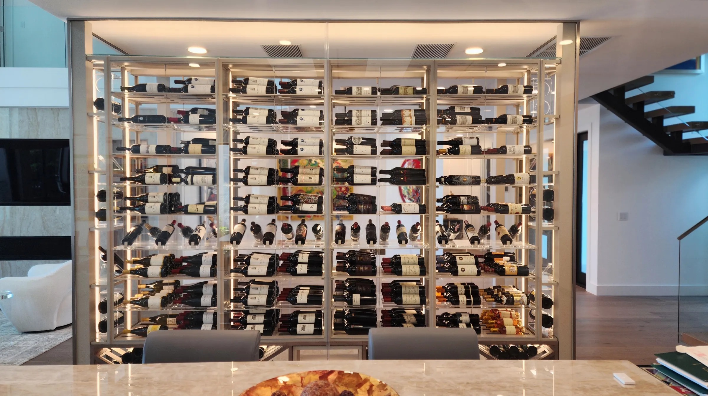Luxury glass wine cellar Miami featuring custom metal and wooden wine racks, LED lighting, and floor-to-ceiling wine storage — photograph 9 of 9