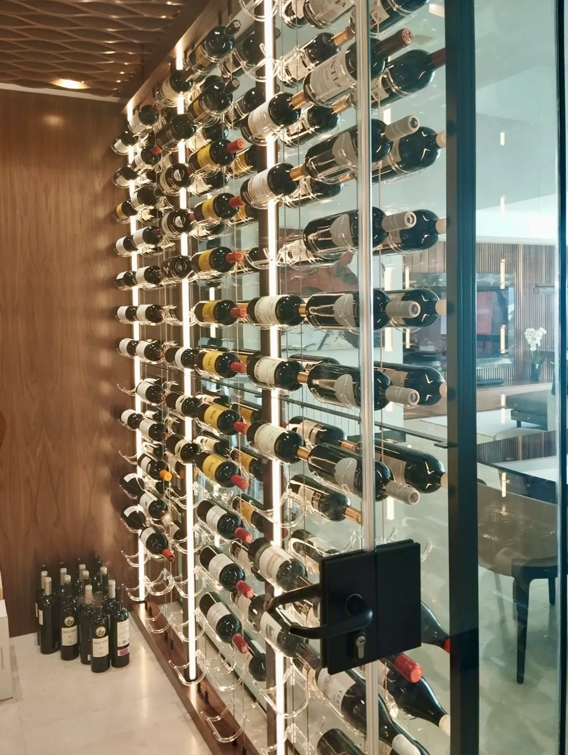 Modern Wine Room Miami - cable system acrylic hooks floating effect, wood bottom cabinet, LED strips — photograph 1 of 2