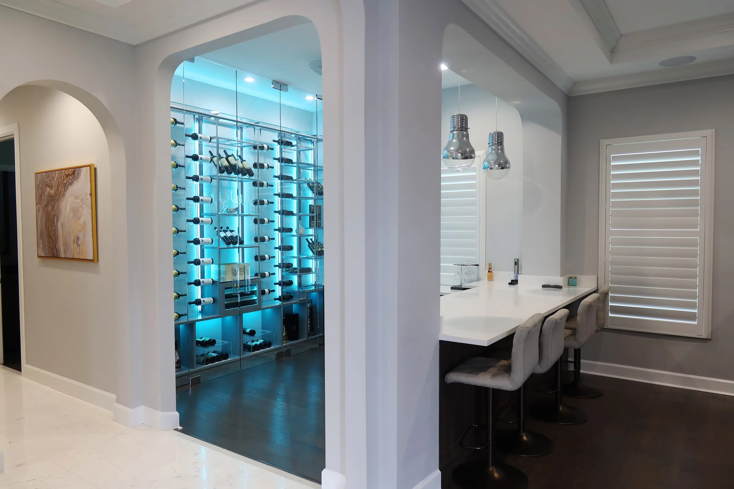 Custom wine wall Miami featuring glass enclosure, illuminated bottle displays, and contemporary luxury wine storage — photograph 2 of 4