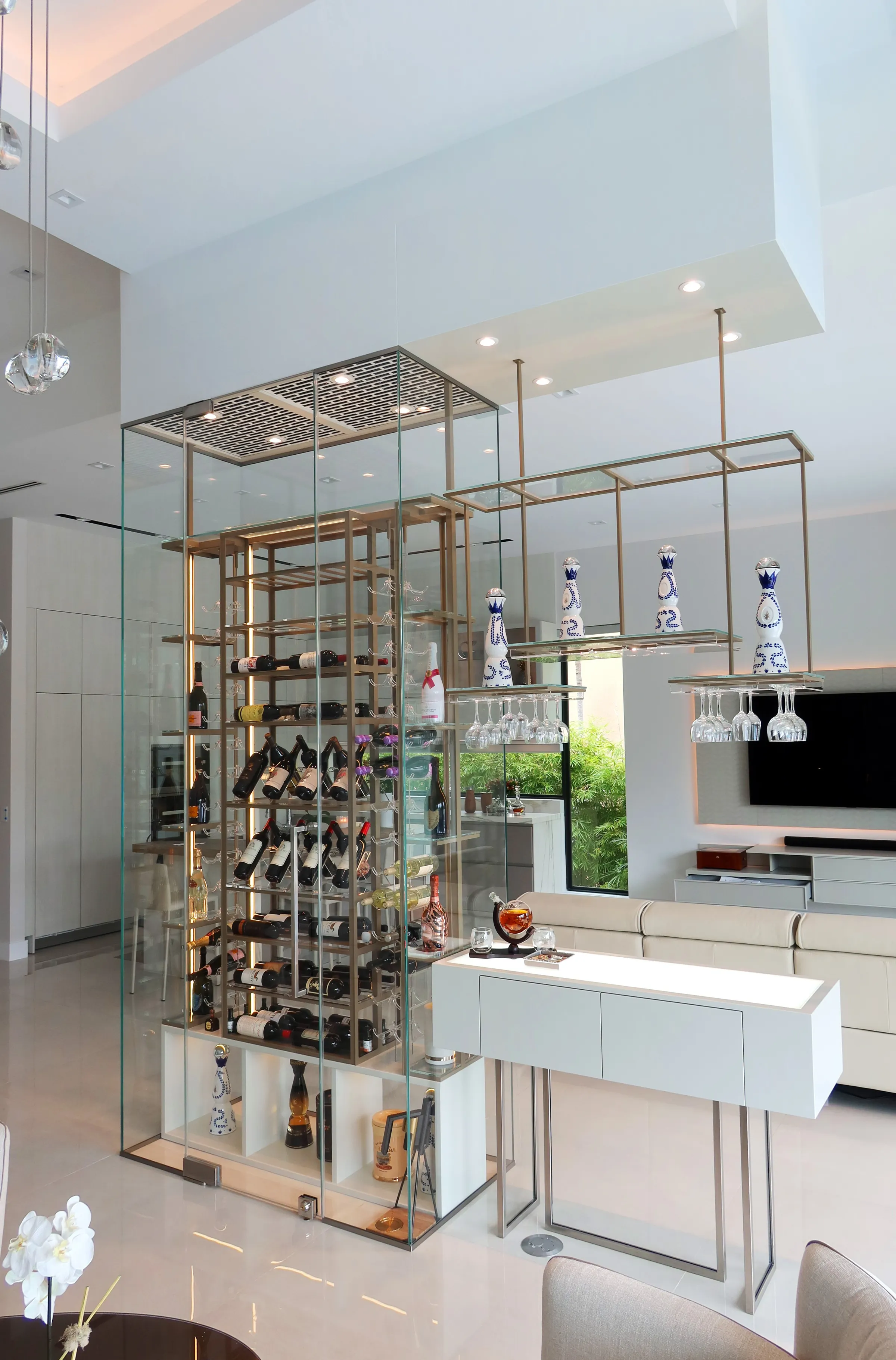 Luxury total glass wine cellar Miami featuring custom floor-to-ceiling metal and wooden wine racks, and LED lighting — photograph 1 of 4
