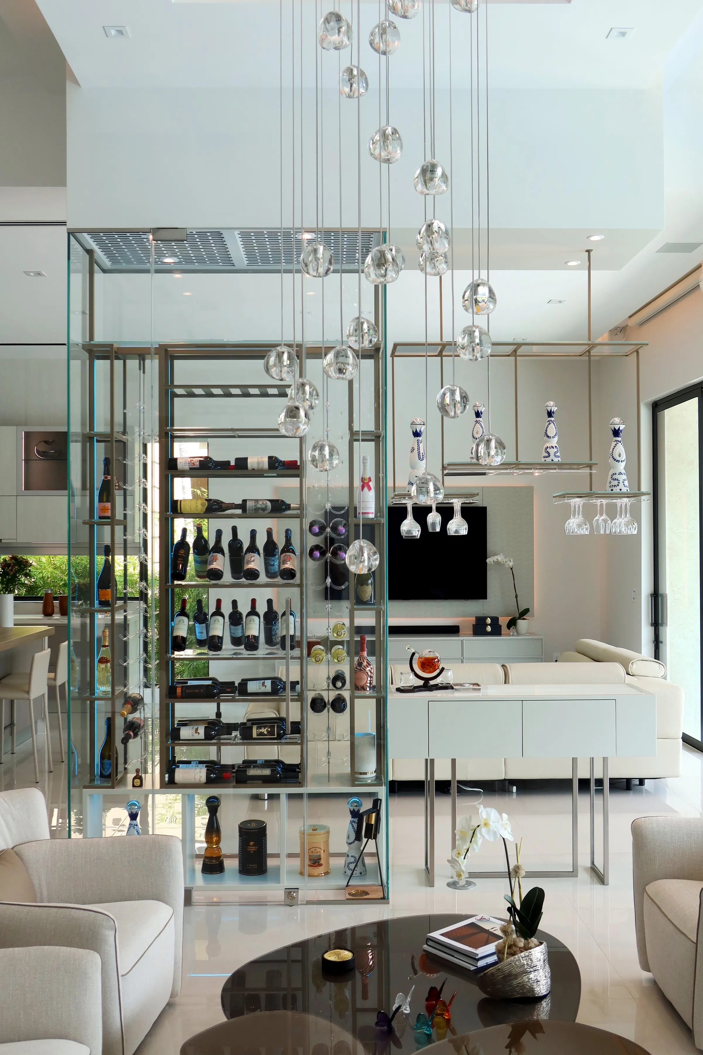 Luxury total glass wine cellar Miami featuring custom floor-to-ceiling metal and wooden wine racks, and LED lighting — photograph 4 of 4