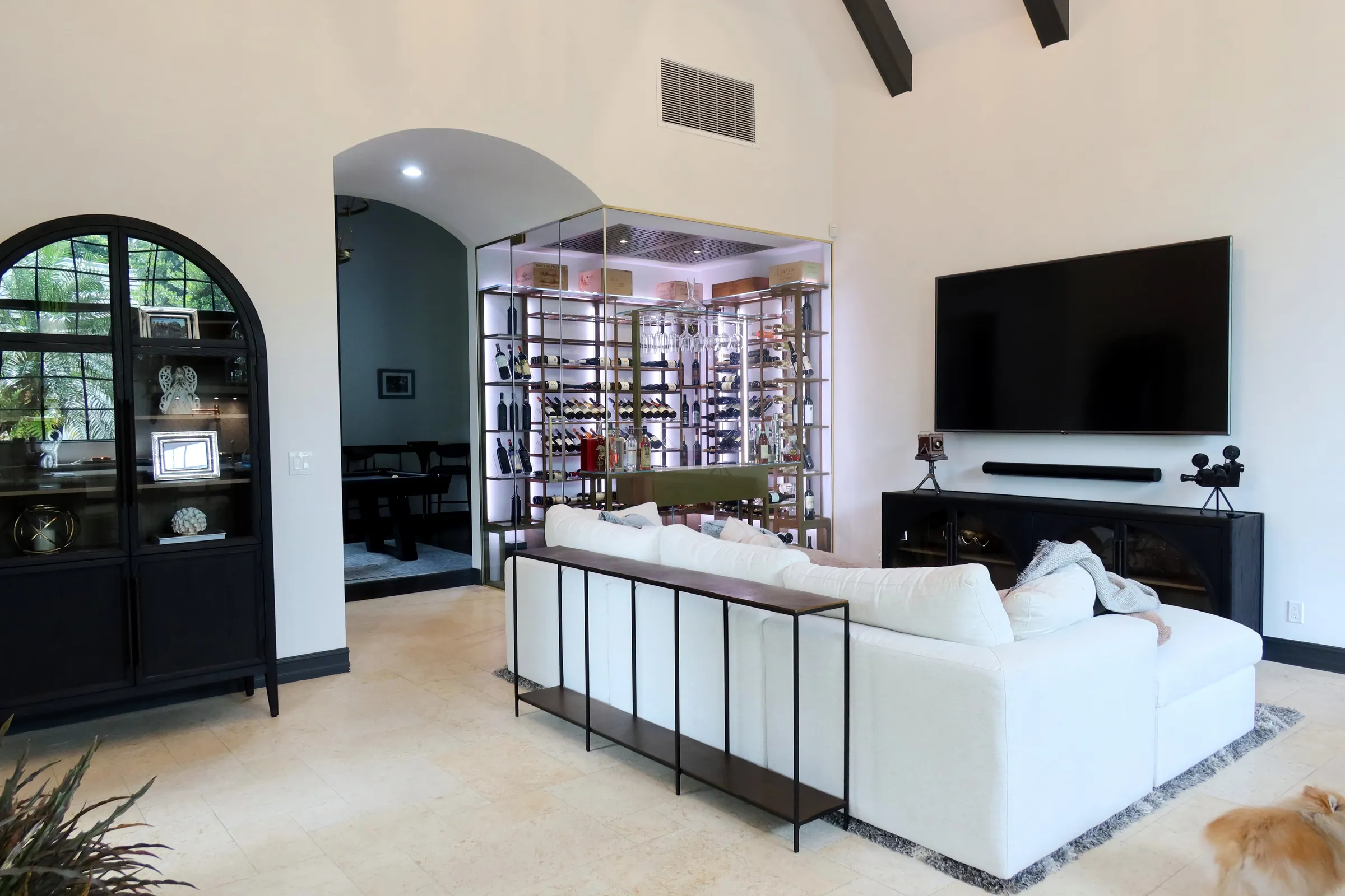 Luxury glass wine cellar Miami featuring custom metal wine racks, LED lighting, and floor-to-ceiling wine storage — photograph 3 of 6