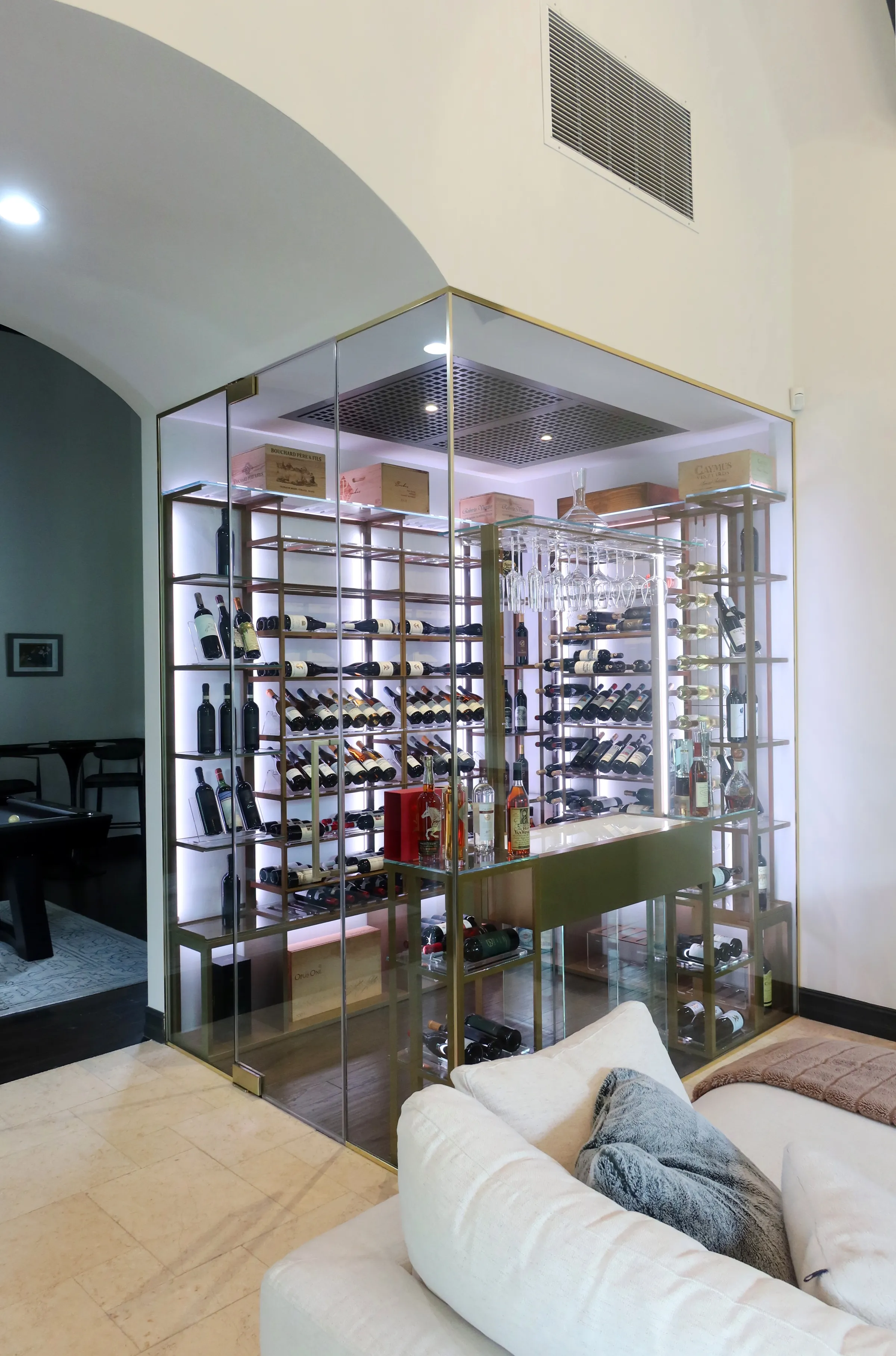 Luxury glass wine cellar Miami featuring custom metal wine racks, LED lighting, and floor-to-ceiling wine storage — photograph 5 of 6