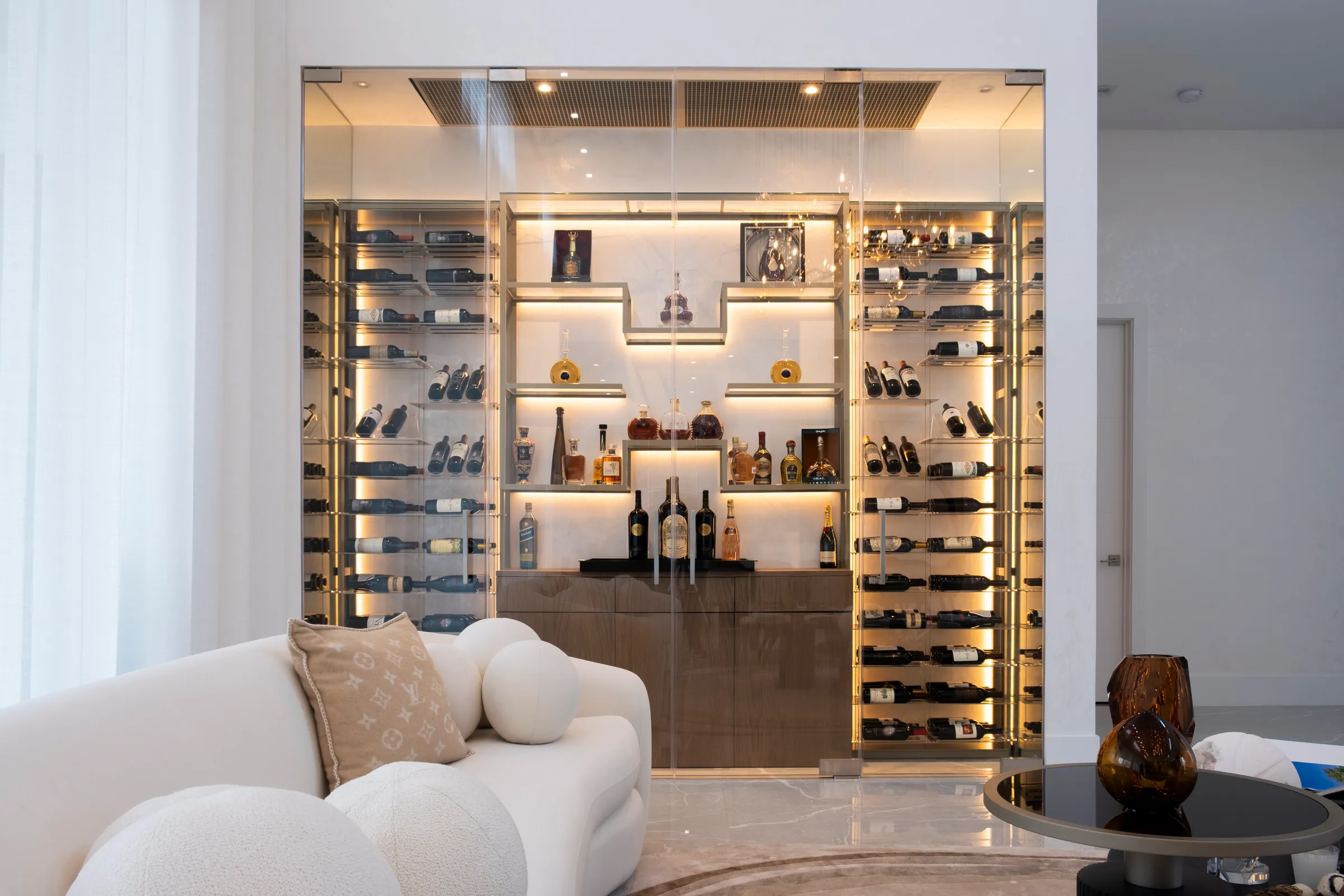 Custom wine wall Miami metal and wooden wine racks, illuminated bottle displays, and contemporary luxury wine storage — photograph 1 of 3