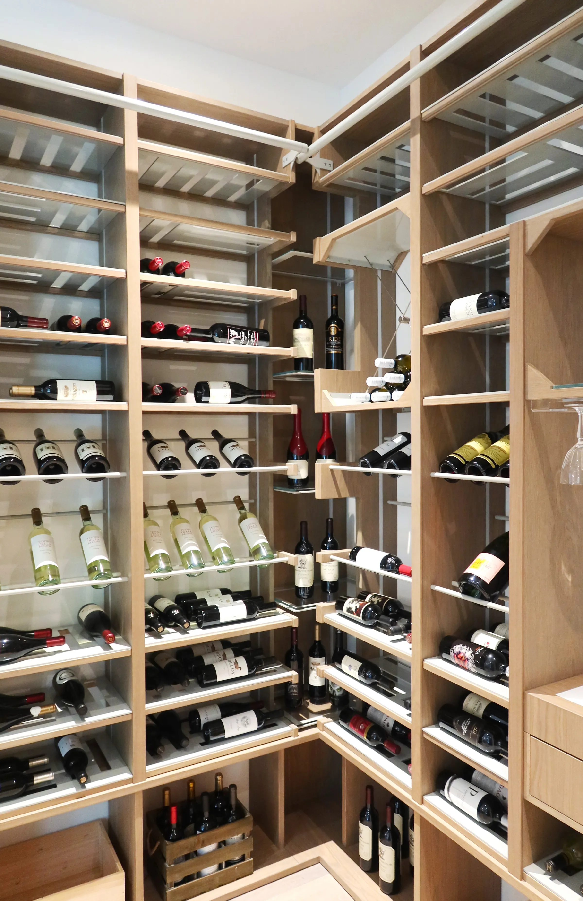 Luxury glass wine cellar Miami featuring custom metal and wooden wine racks, LED lighting, and floor-to-ceiling wine storage — photograph 3 of 4