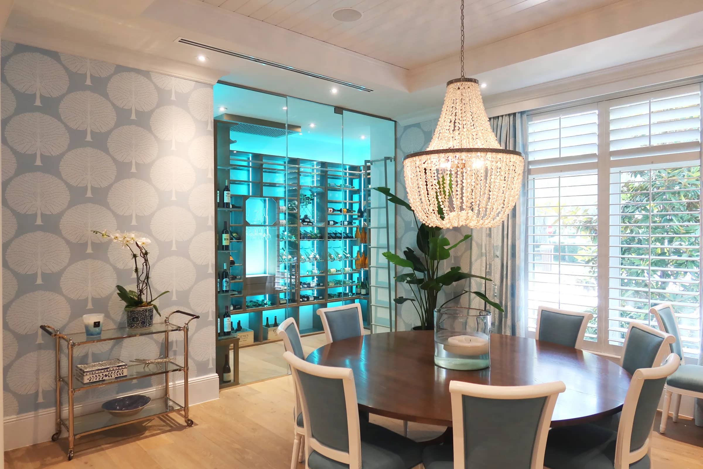 Luxury glass wine cellar Miami featuring custom metal and wooden wine racks, LED lighting, and floor-to-ceiling wine storage — photograph 4 of 4