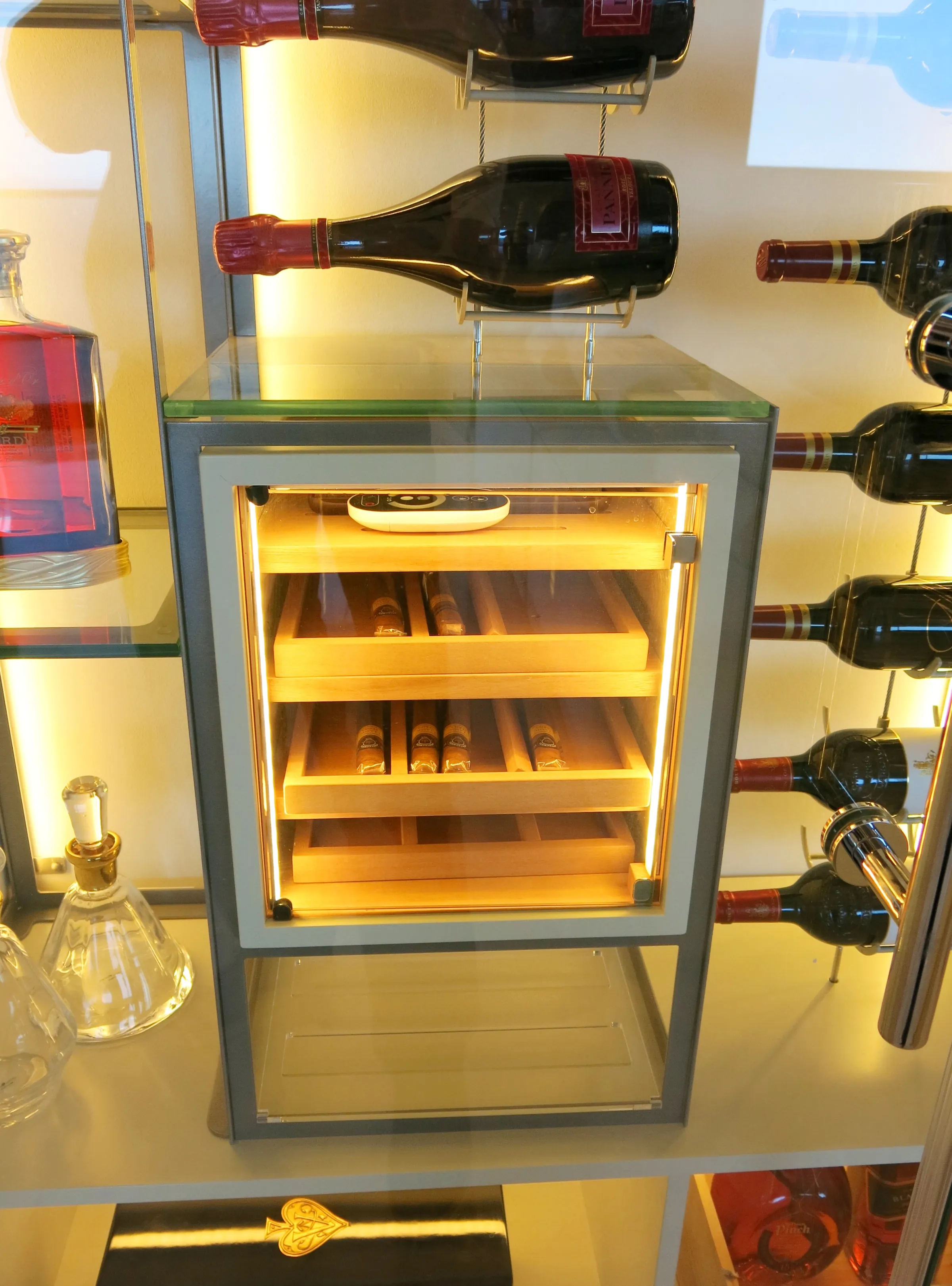 Custom wine wall Miami featuring glass enclosure, illuminated bottle displays, and contemporary, metal and wood, luxury wine storage — photograph 3 of 3