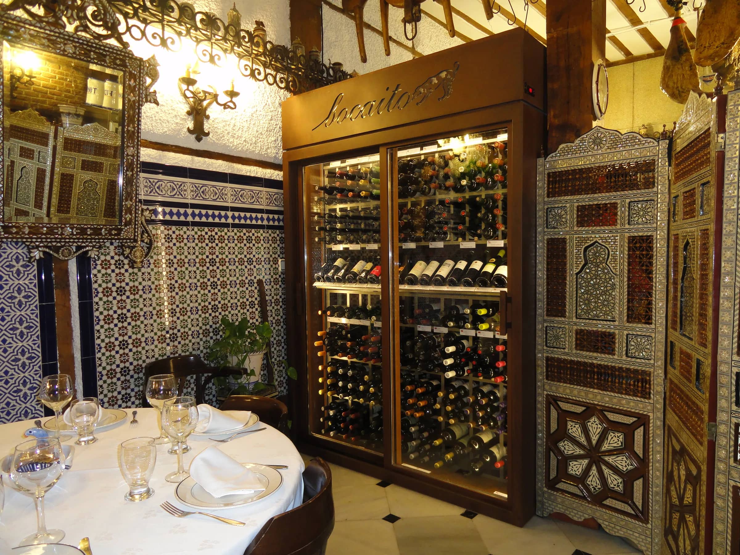 Restaurant wine cellar Madrid Spain Rest Bocaito glass enclosures native materials