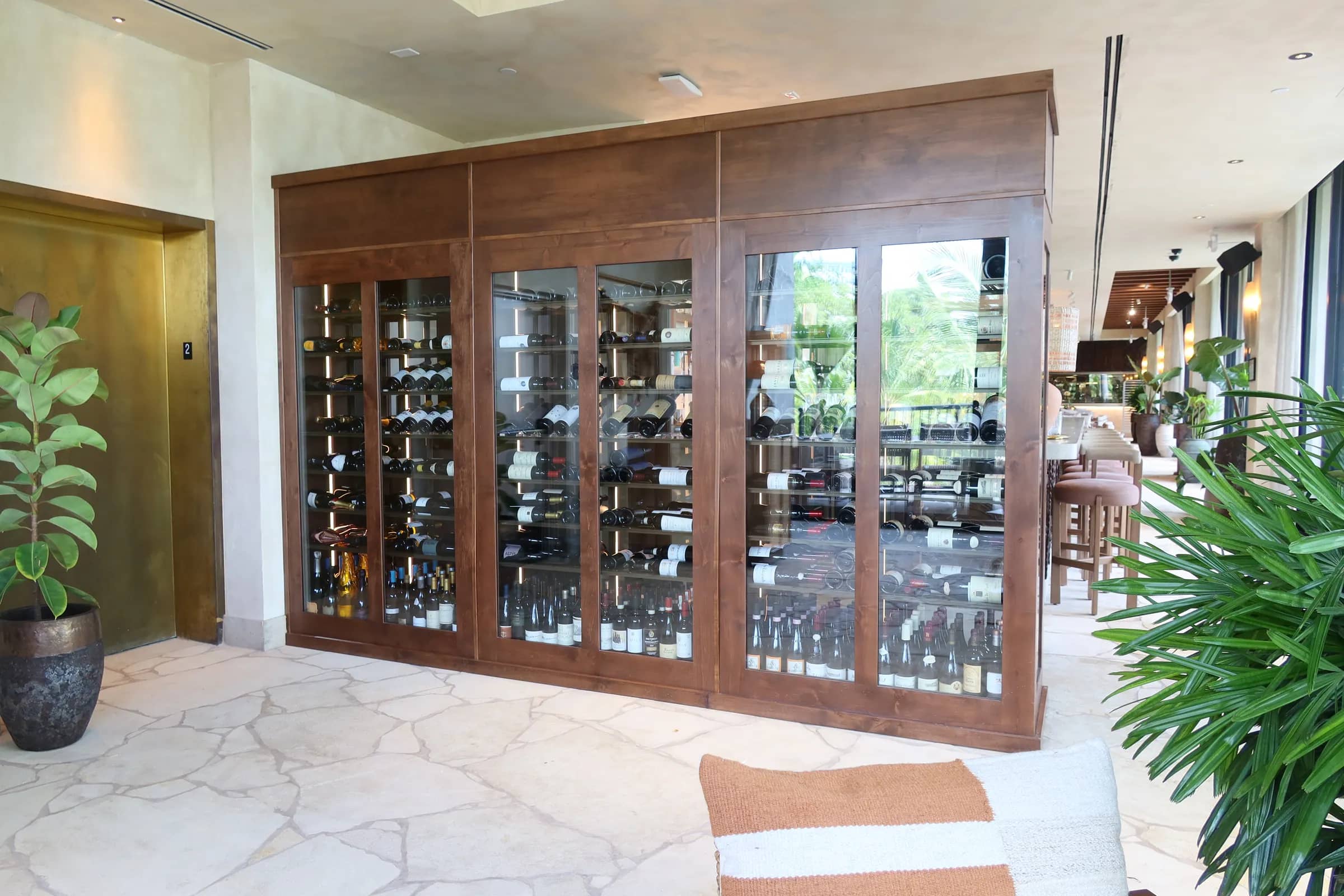 Restaurant wine cellar Miami Casa NEOS glass enclosures wine collection wine wall