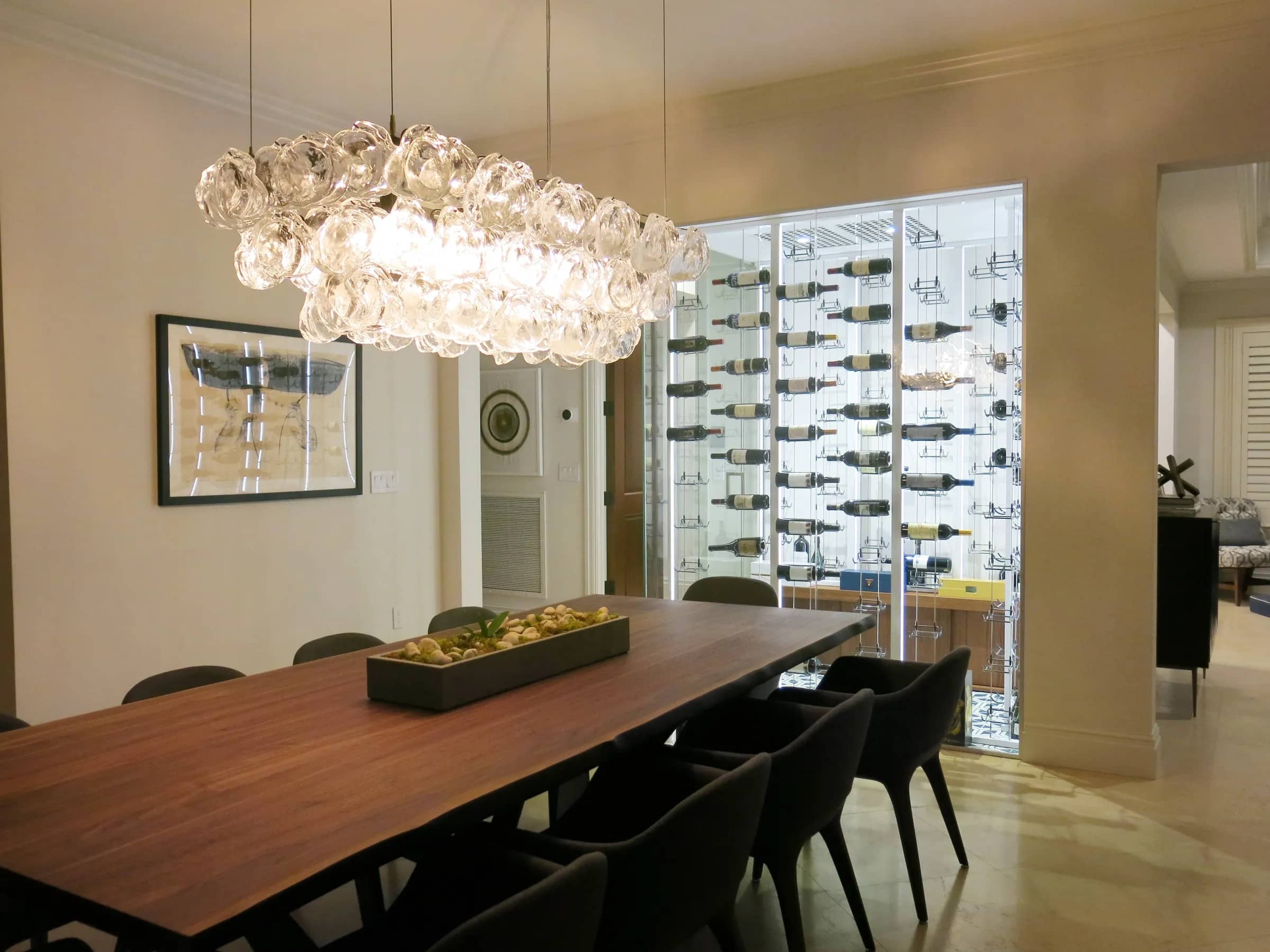 Luxury glass wine cellar Miami featuring custom floor-to-ceiling metal and wooden wine racks, and LED lighting — photograph 1 of 4