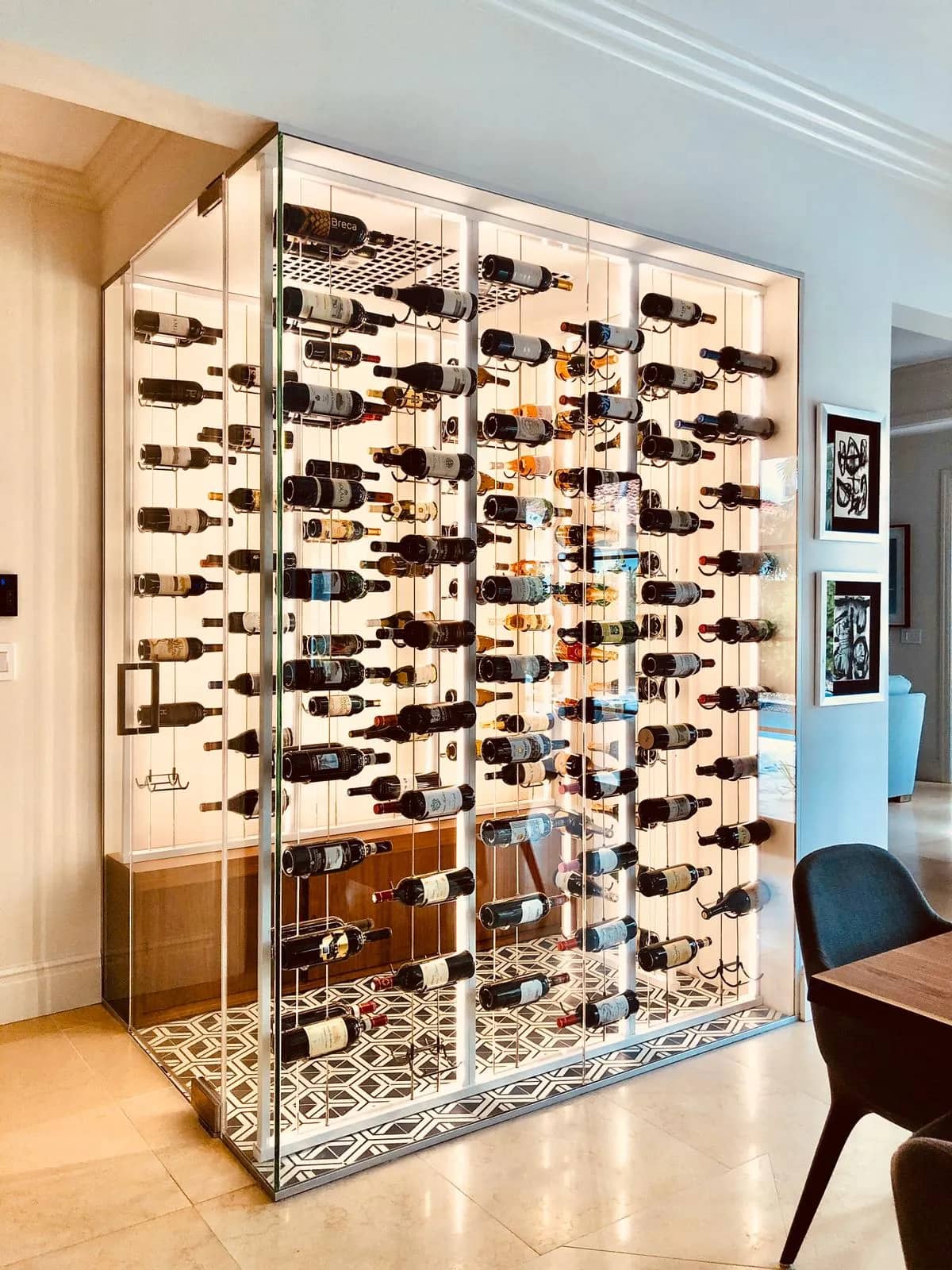 Luxury glass wine cellar Miami featuring custom floor-to-ceiling metal and wooden wine racks, and LED lighting — photograph 2 of 4