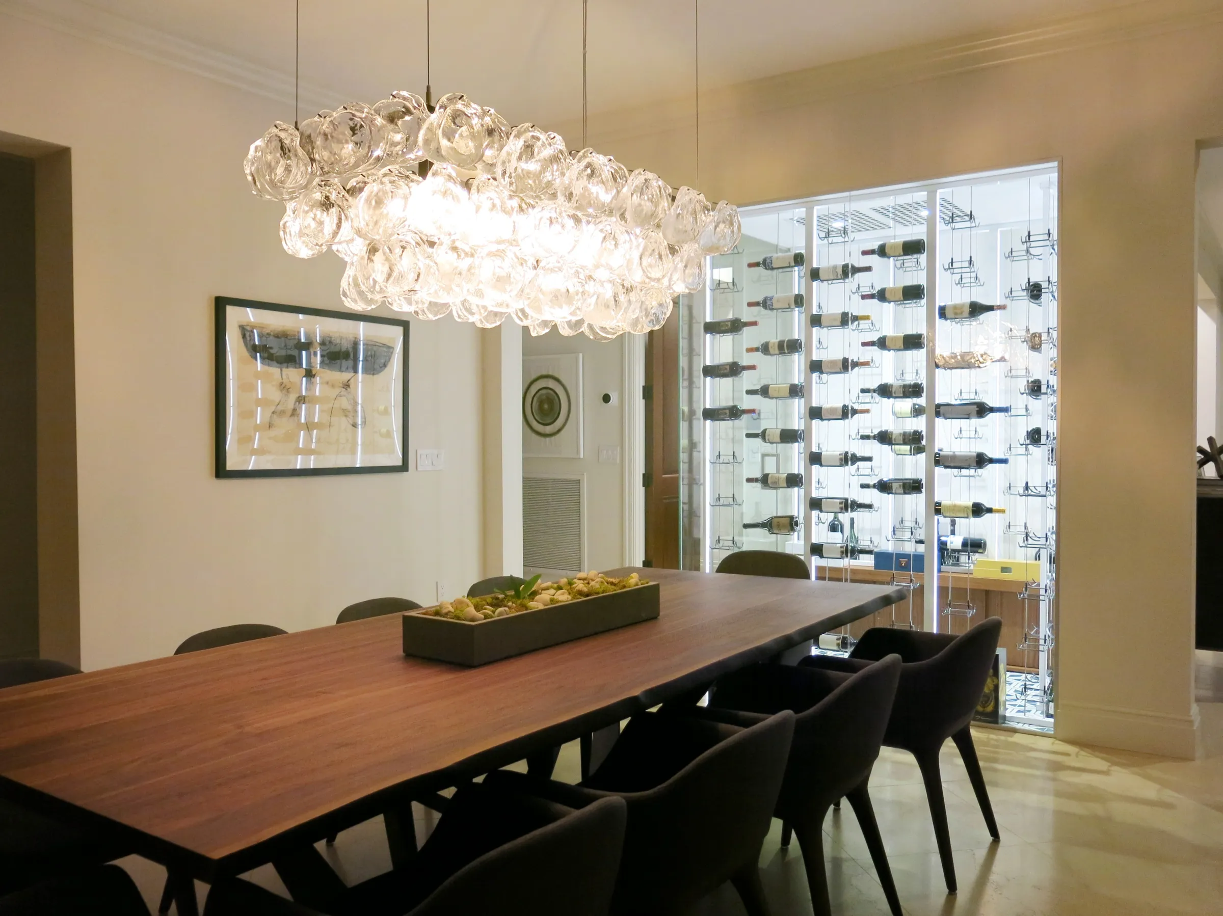 Luxury glass wine cellar Miami featuring custom floor-to-ceiling metal and wooden wine racks, and LED lighting — photograph 4 of 4