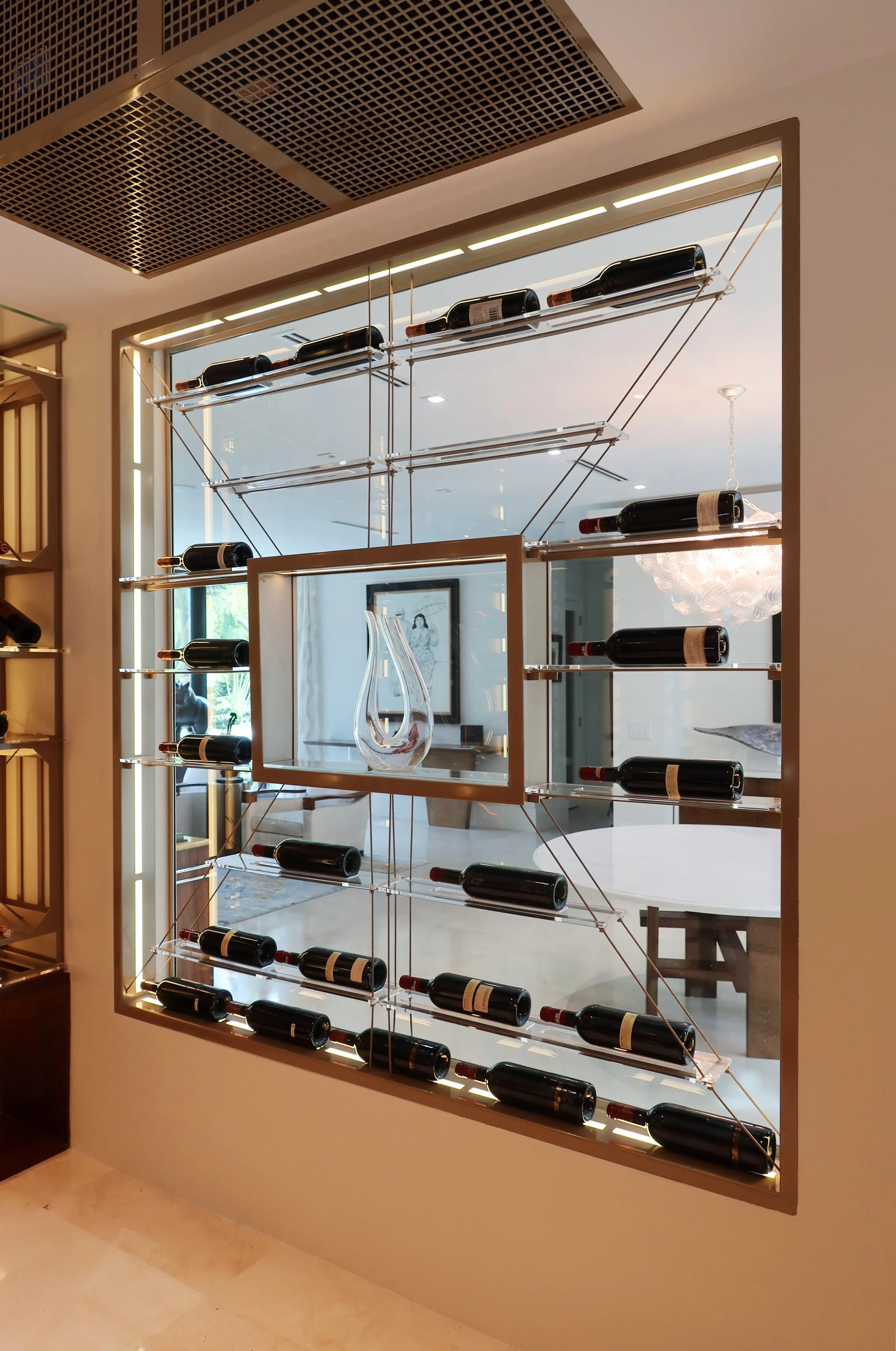 Luxury wine cellar Miami featuring custom floor-to-ceiling metal and wooden wine racks, LED lighting, and tasting table — photograph 3 of 4