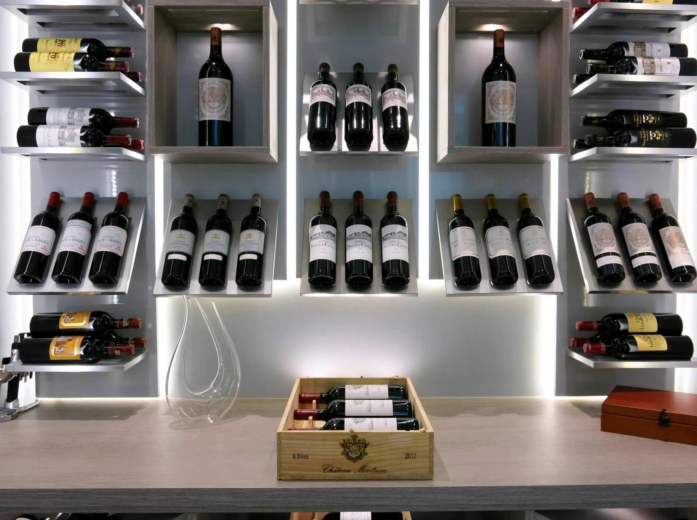 Luxury glass wine cellar Miami featuring custom metal and wooden wine racks, LED lighting, and floor-to-ceiling wine storage — photograph 1 of 4