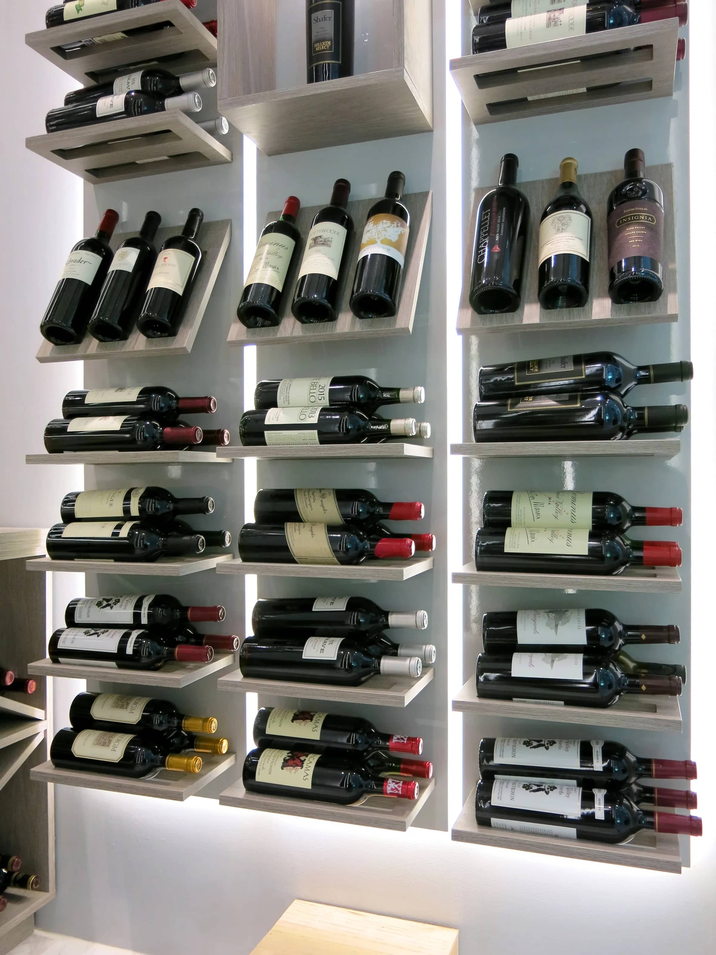 Luxury glass wine cellar Miami featuring custom metal and wooden wine racks, LED lighting, and floor-to-ceiling wine storage — photograph 2 of 4