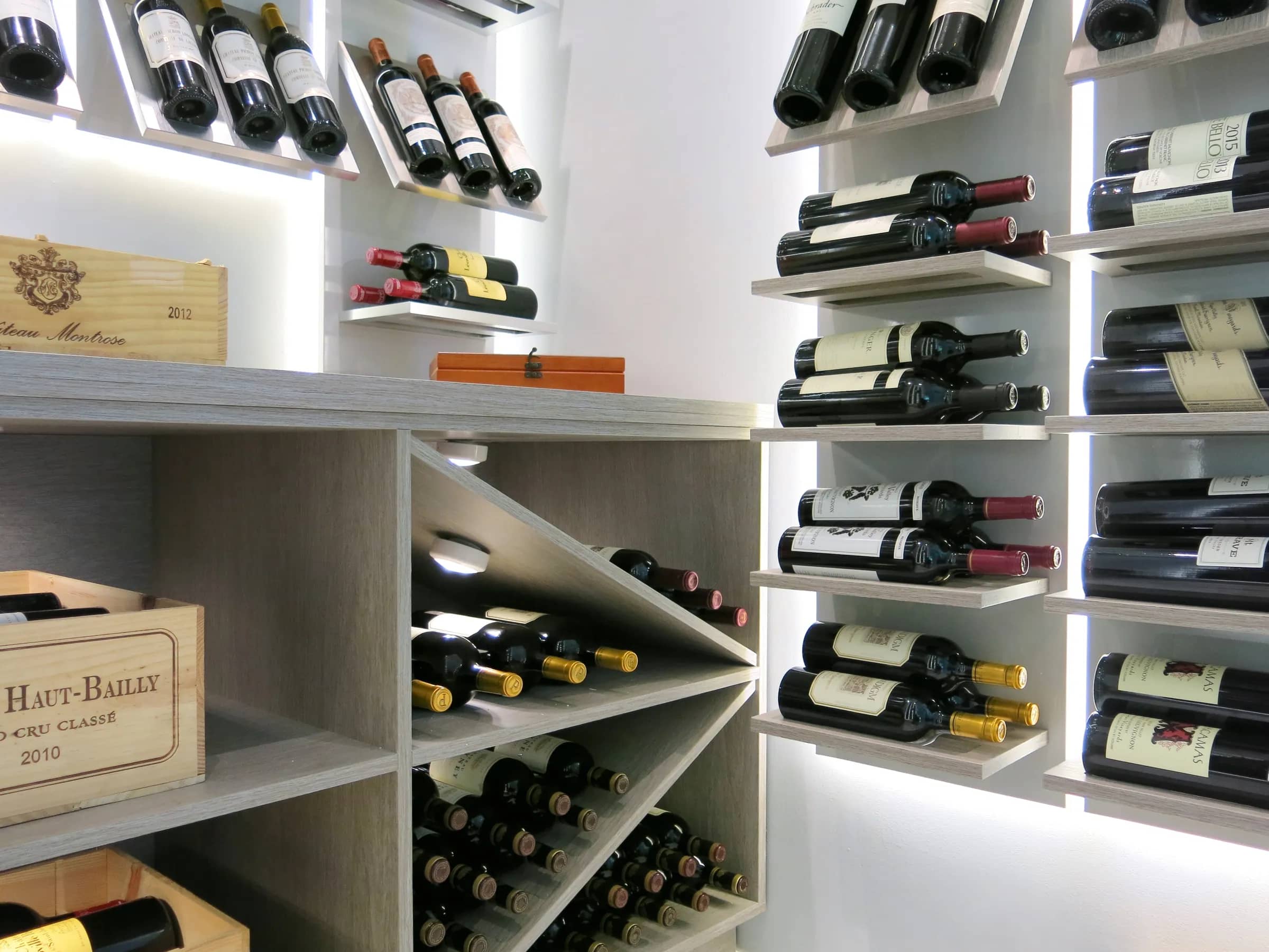 Luxury glass wine cellar Miami featuring custom metal and wooden wine racks, LED lighting, and floor-to-ceiling wine storage — photograph 3 of 4