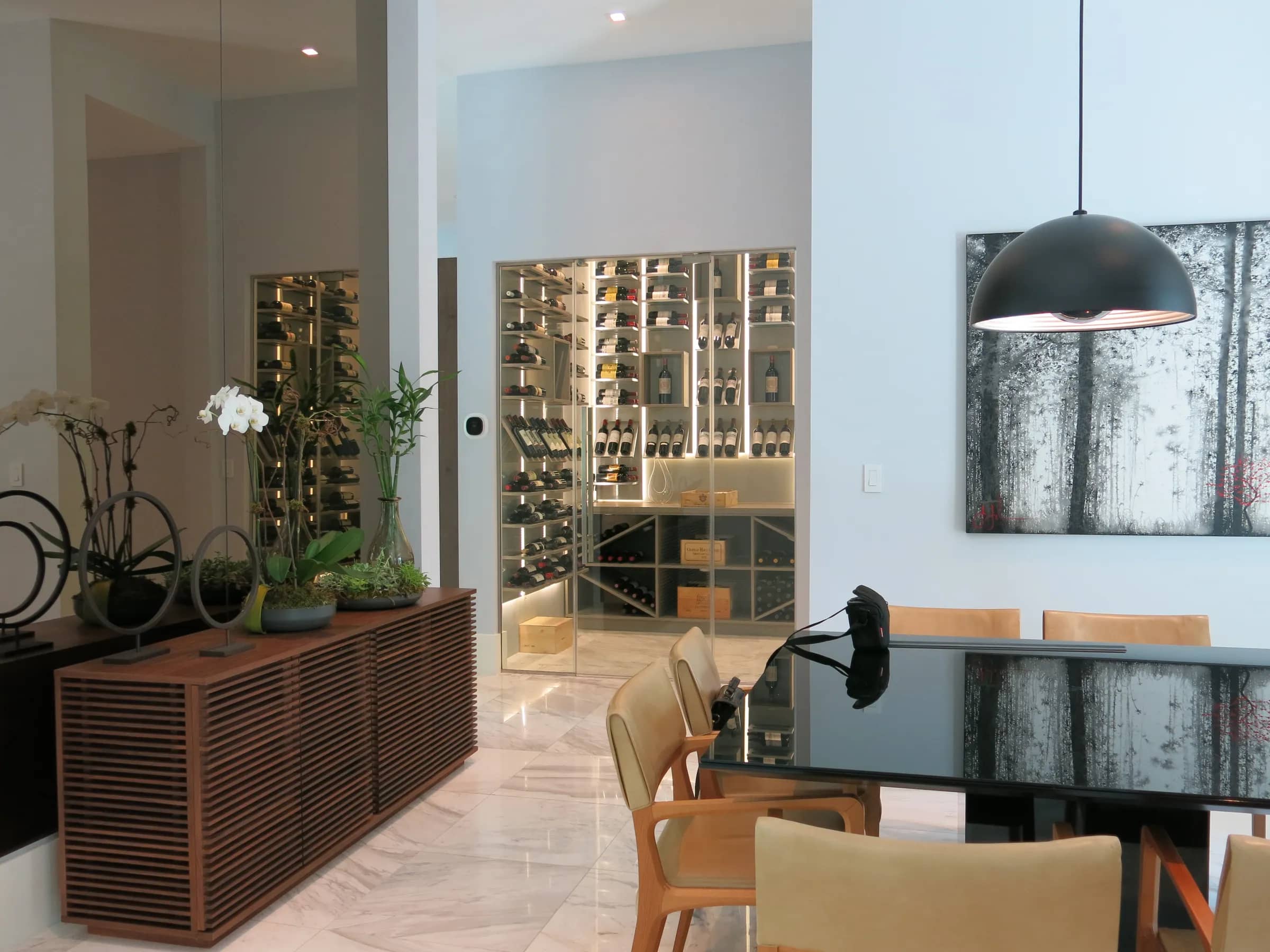 Luxury glass wine cellar Miami featuring custom metal and wooden wine racks, LED lighting, and floor-to-ceiling wine storage — photograph 4 of 4